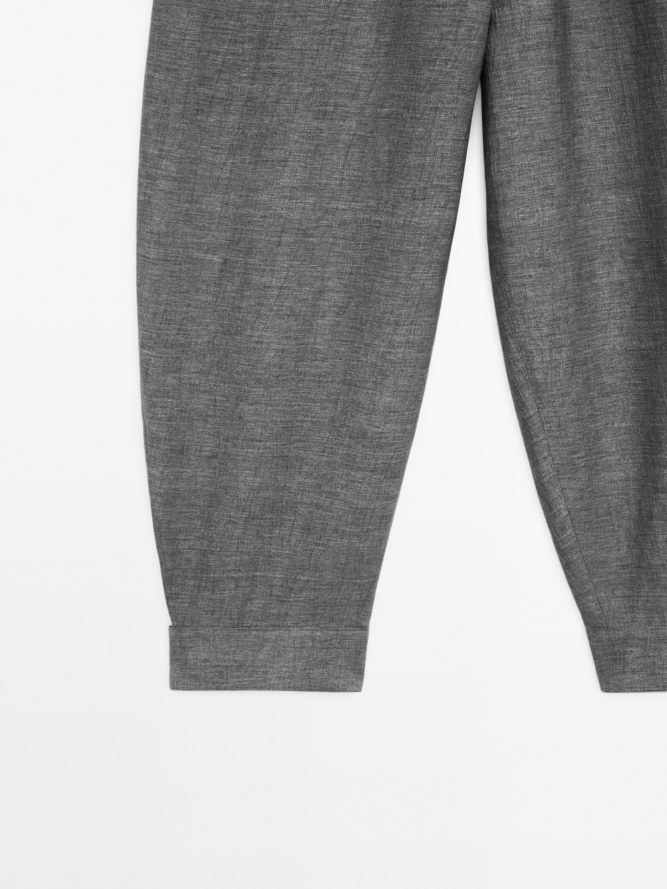 Balloon fit trousers with button details