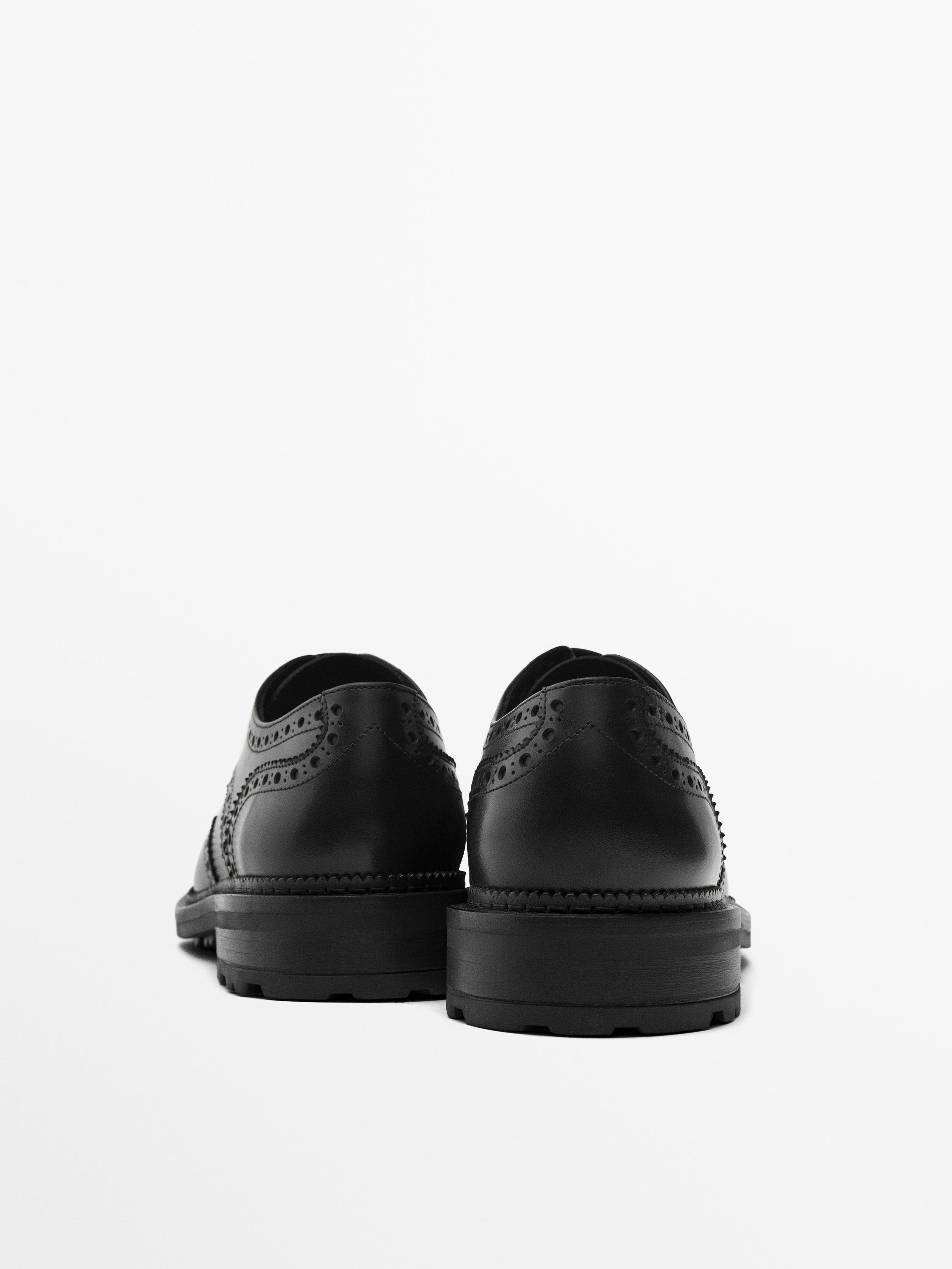 Black leather brogues