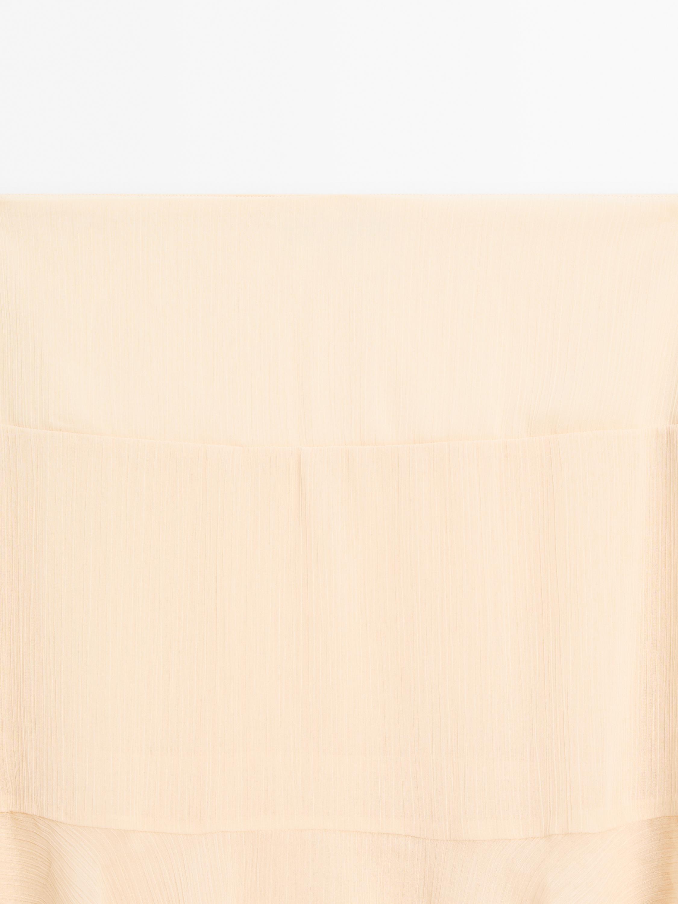Long ruffled skirt with sash