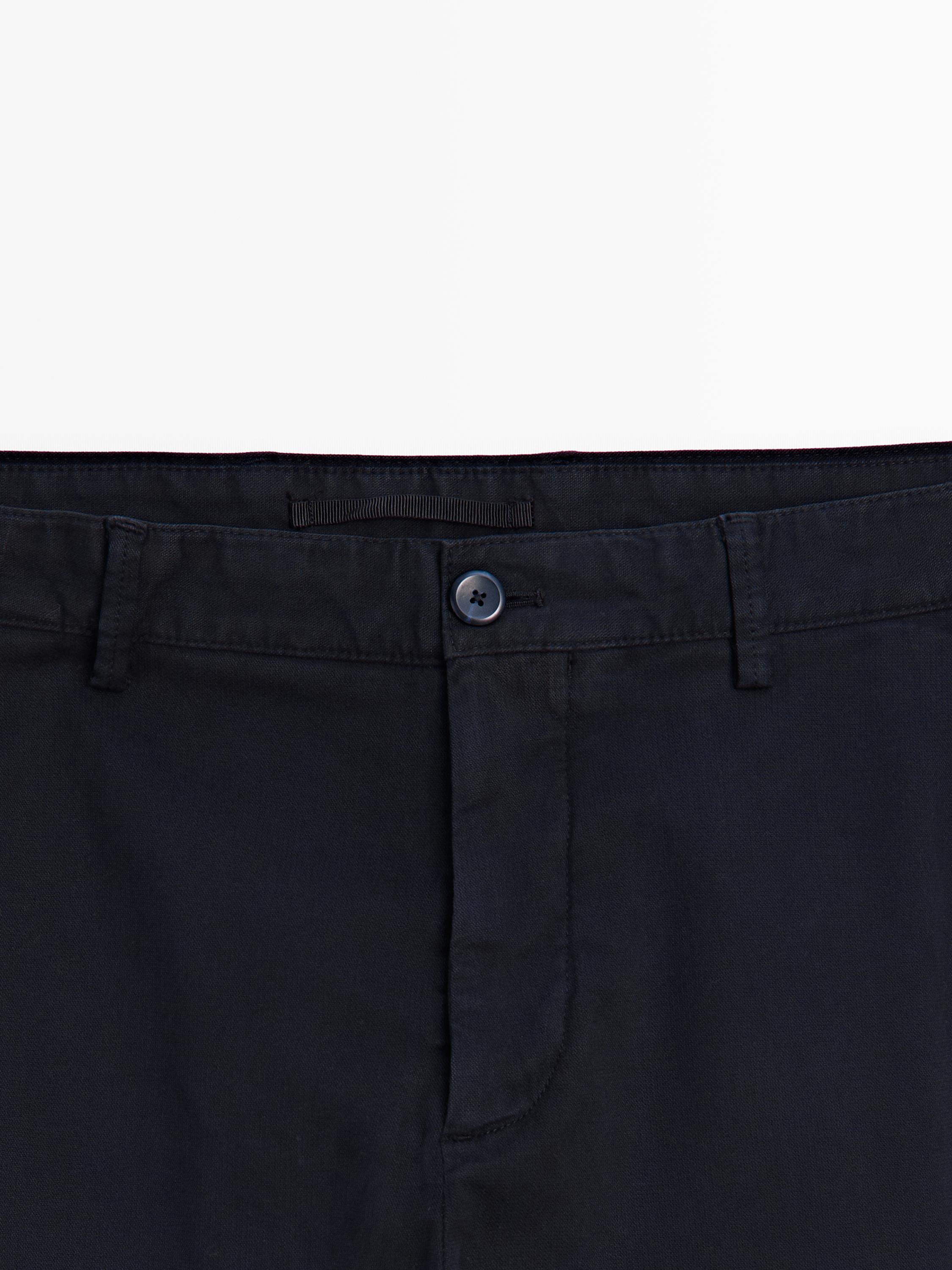 Slim-fit micro-textured trousers — NAVY BLUE