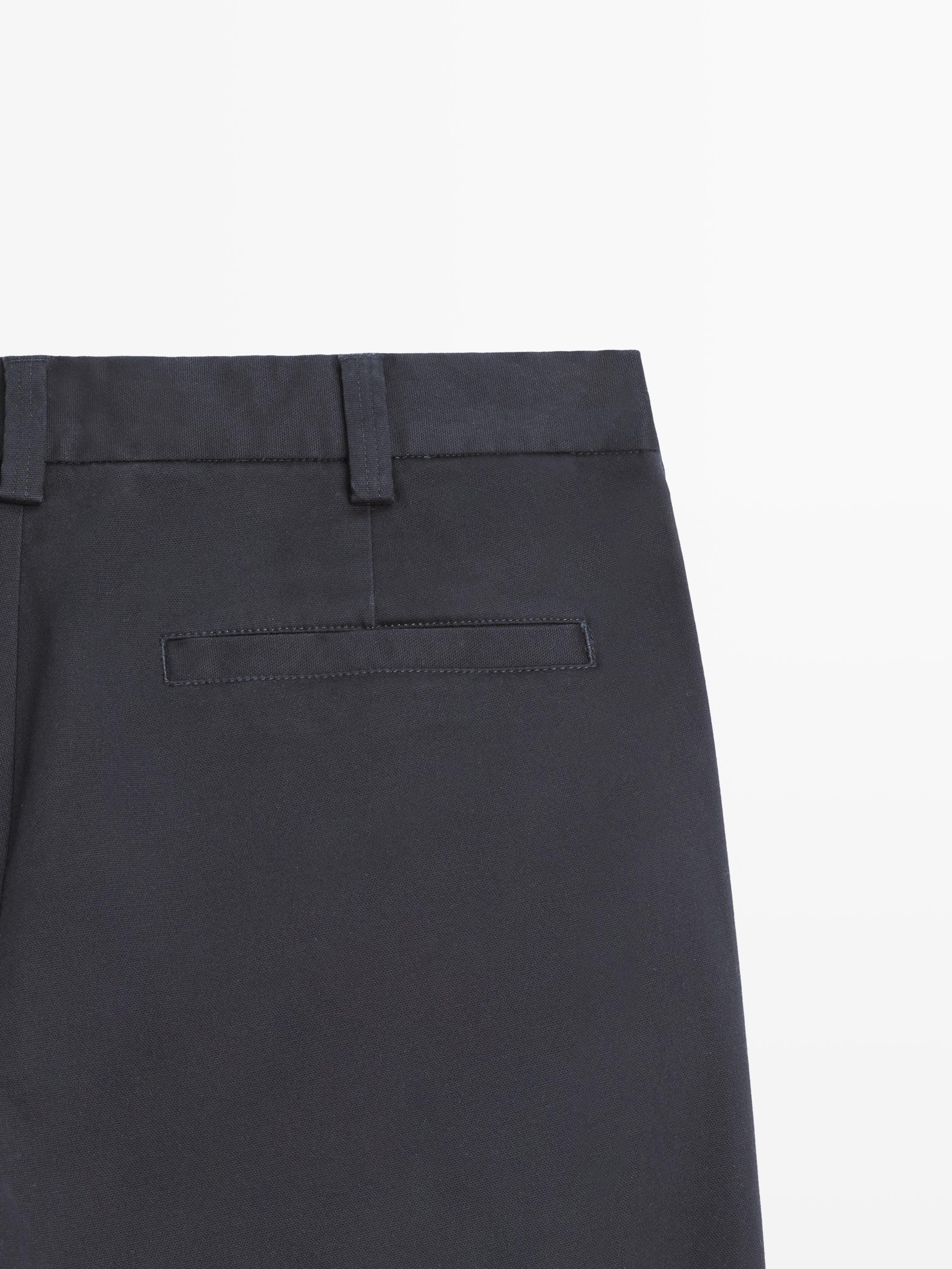Tapered fit micro textured trousers — NAVY BLUE