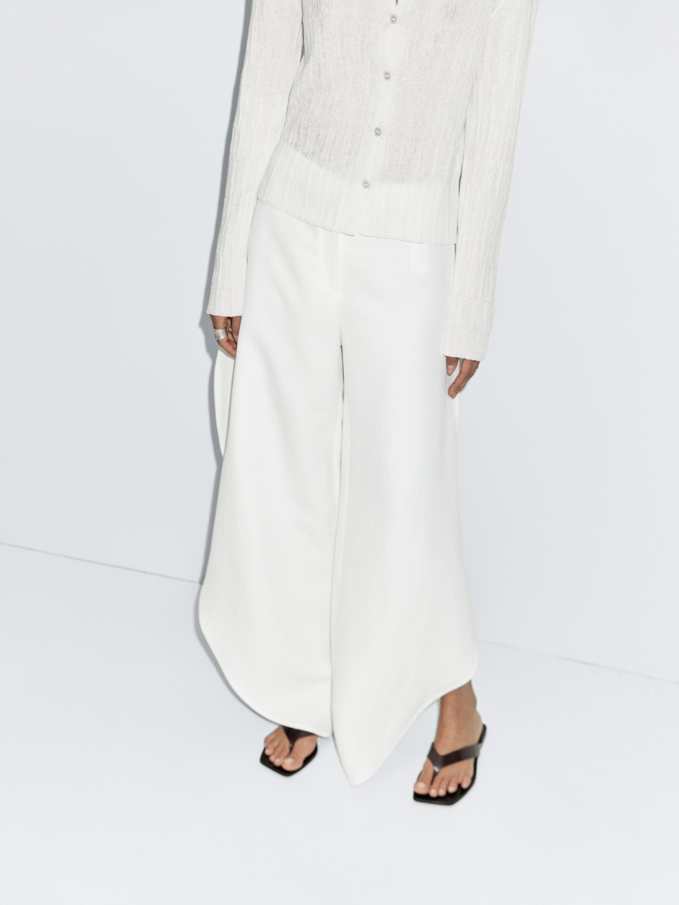 Pantalon fendu dans le bas