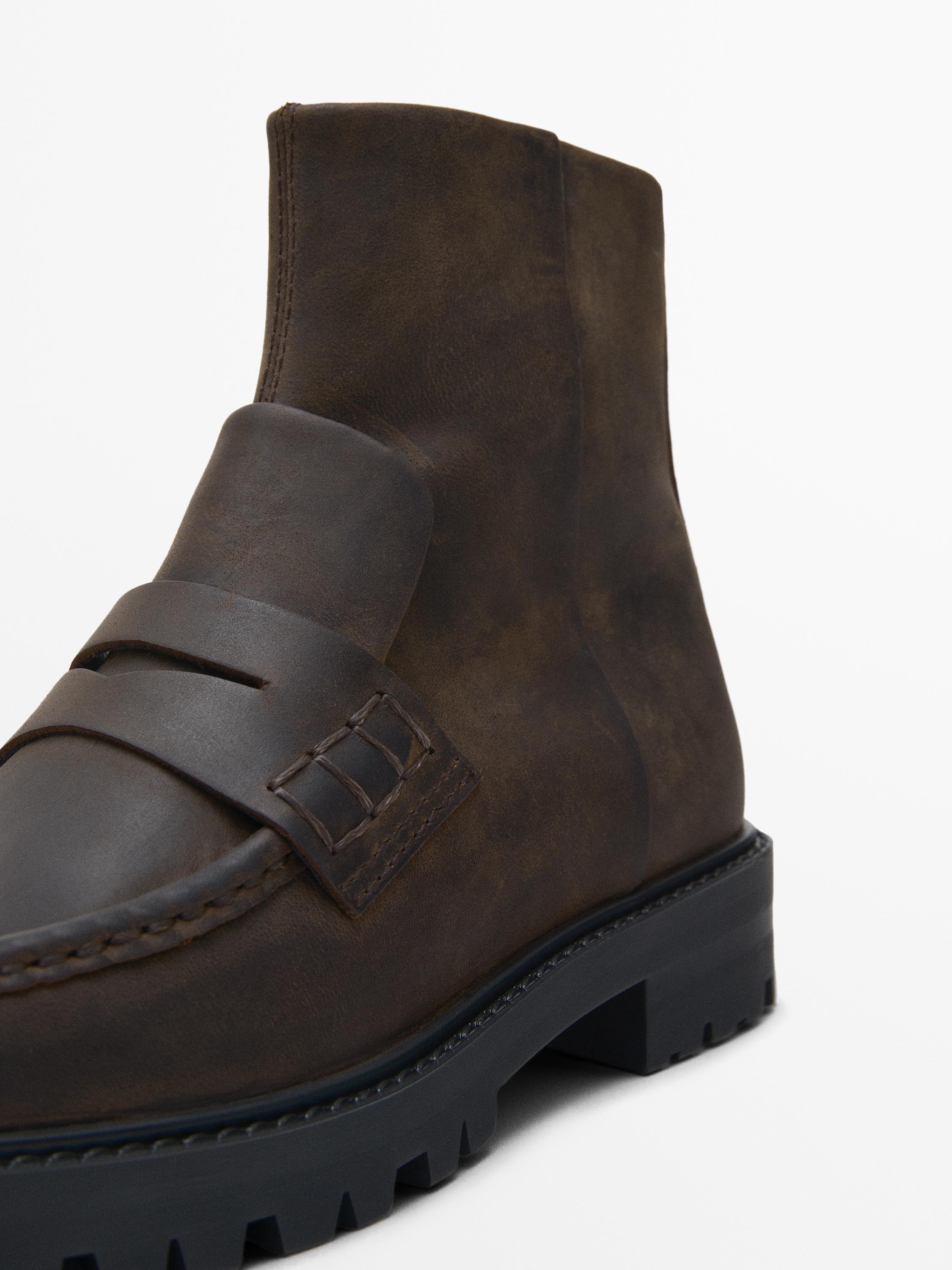 Track sole ankle boots with penny strap