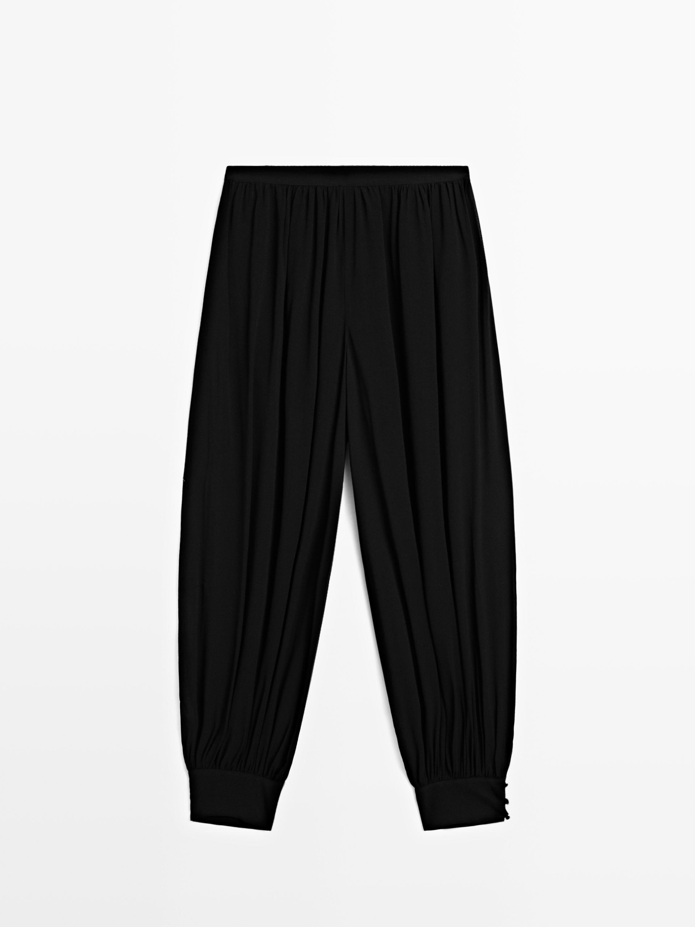 Pantaloni bombati con dettaglio di bottoni