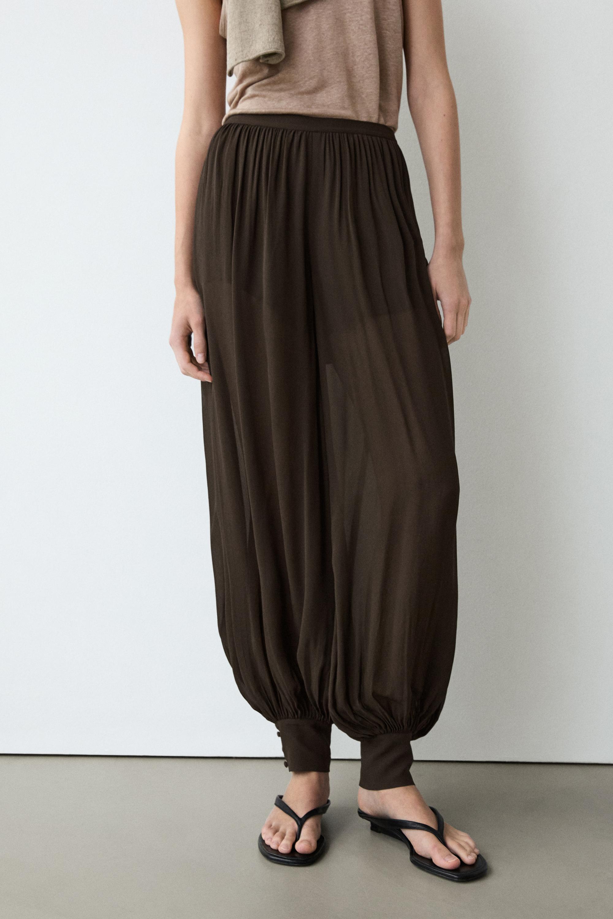 Semi-sheer sarouel trousers with button details