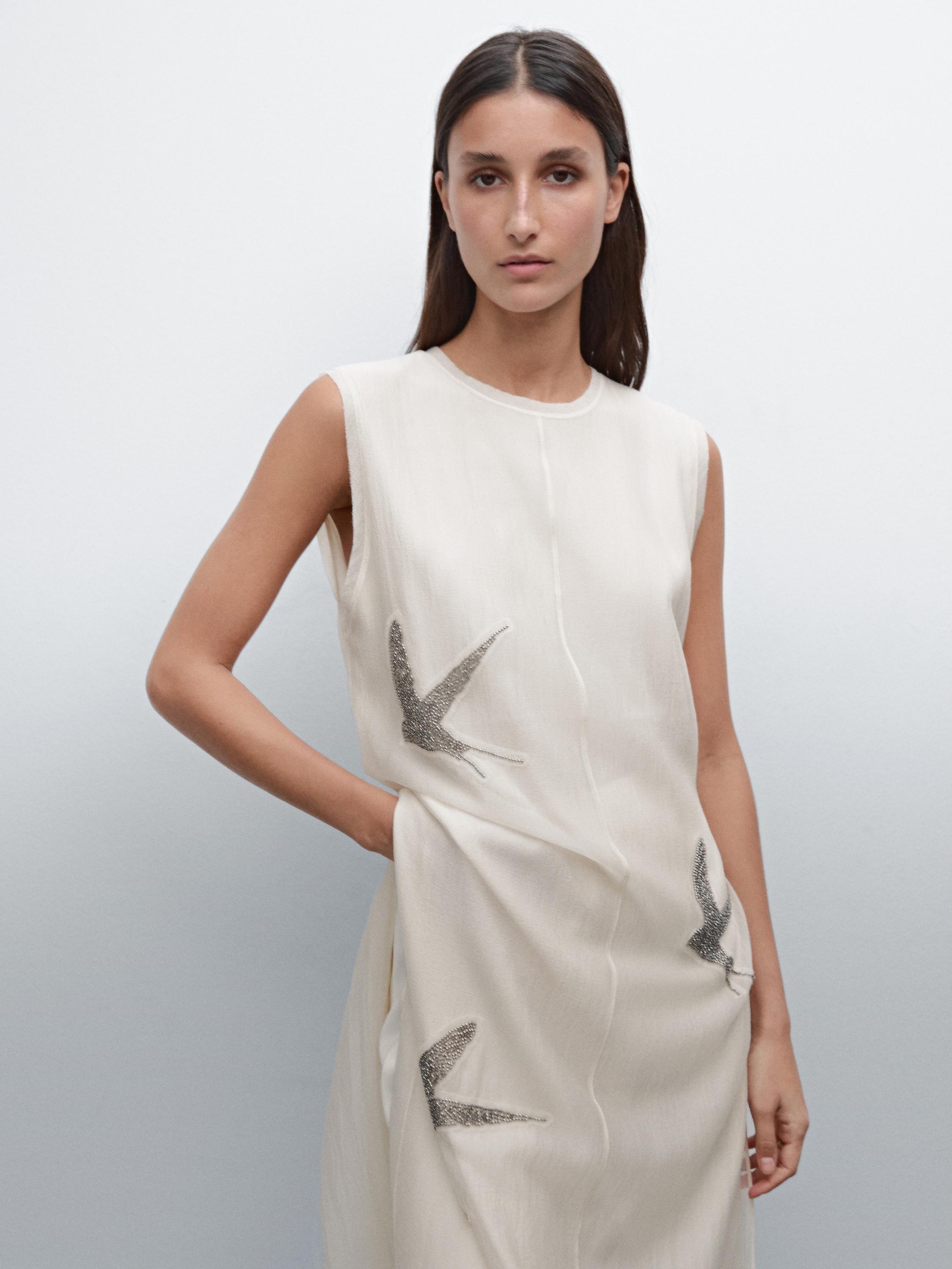 Tunic top with embroidered details