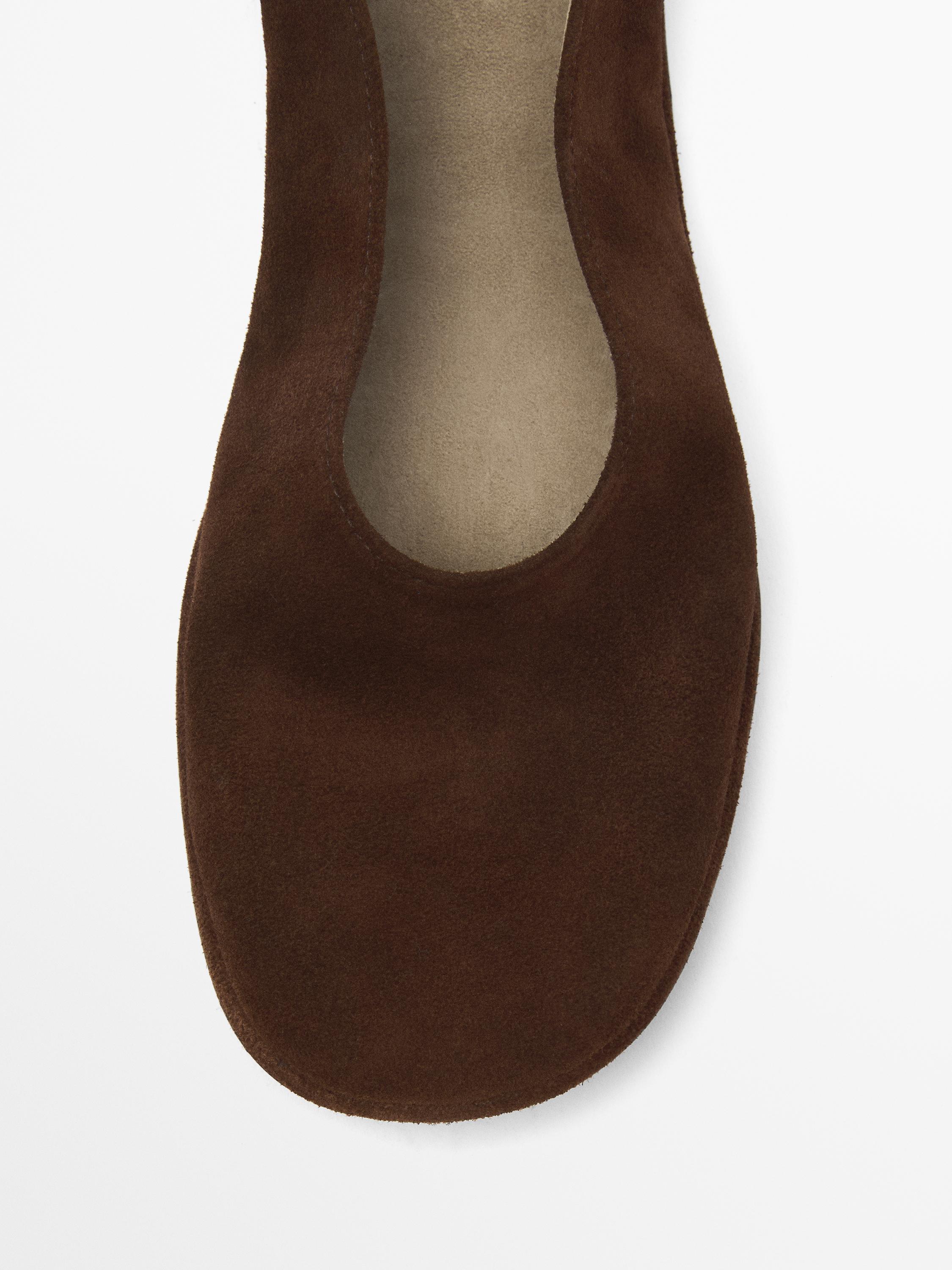 Ballet flats with buckled ankle strap