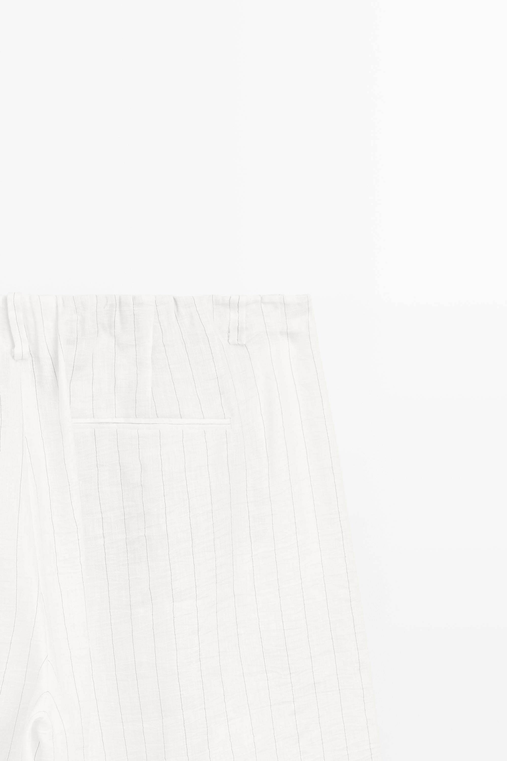 Striped pleated flowing pants - STUDIO — CREAM