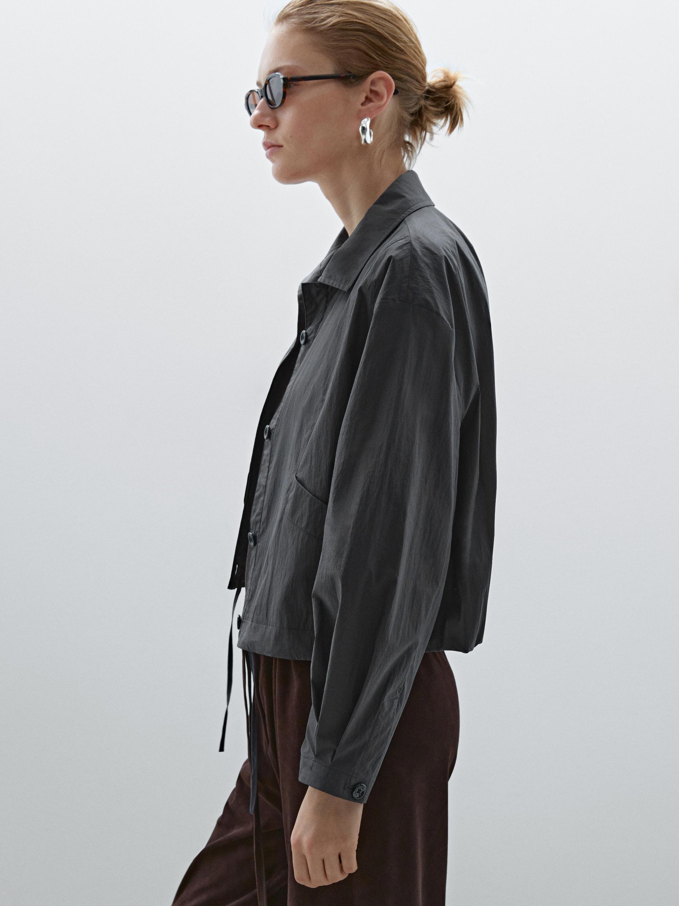Bomber jacket with seams and gathering