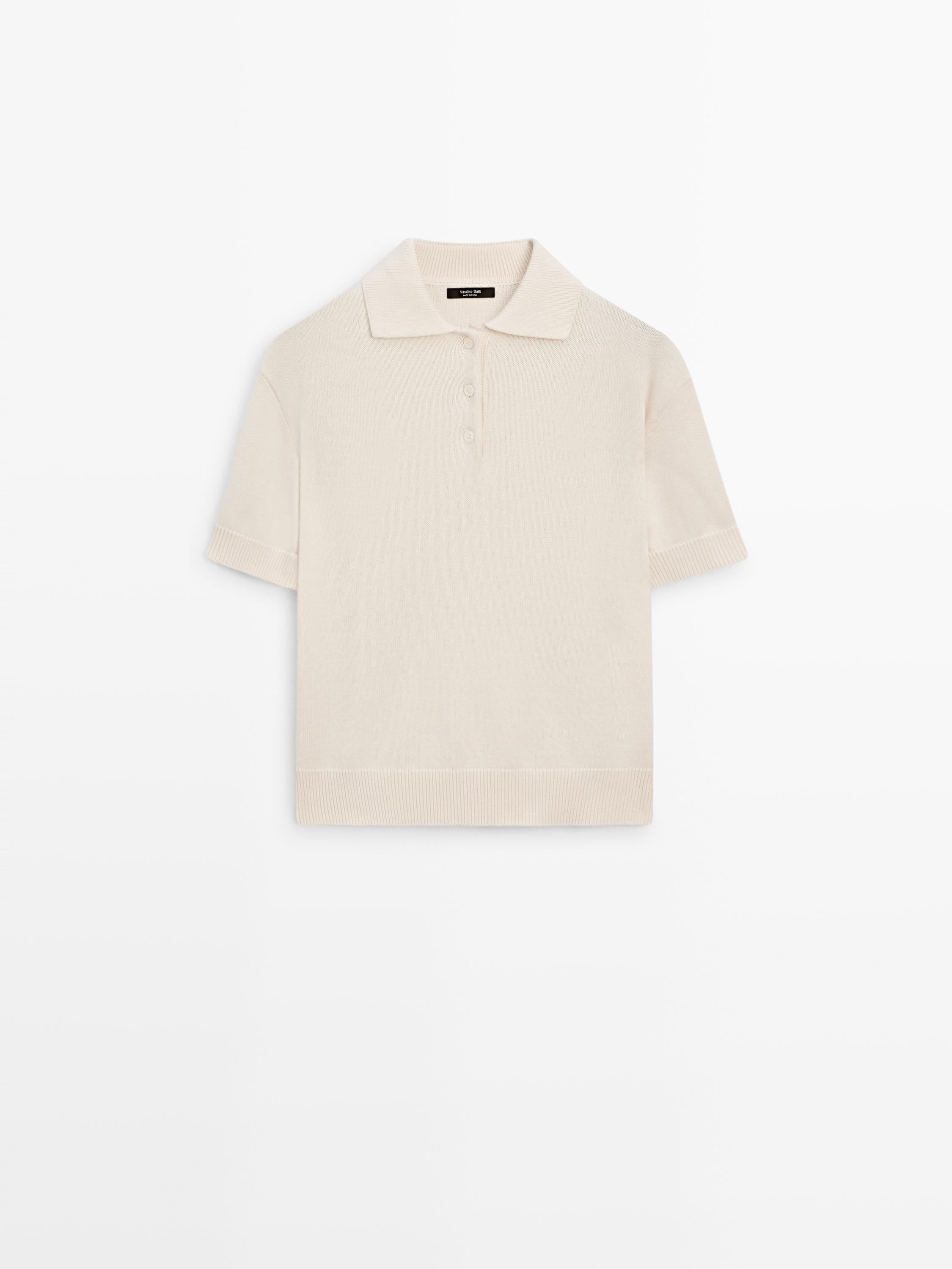 Front view of an polo shirt with a classic collar, three-button placket, and short sleeves with trim.