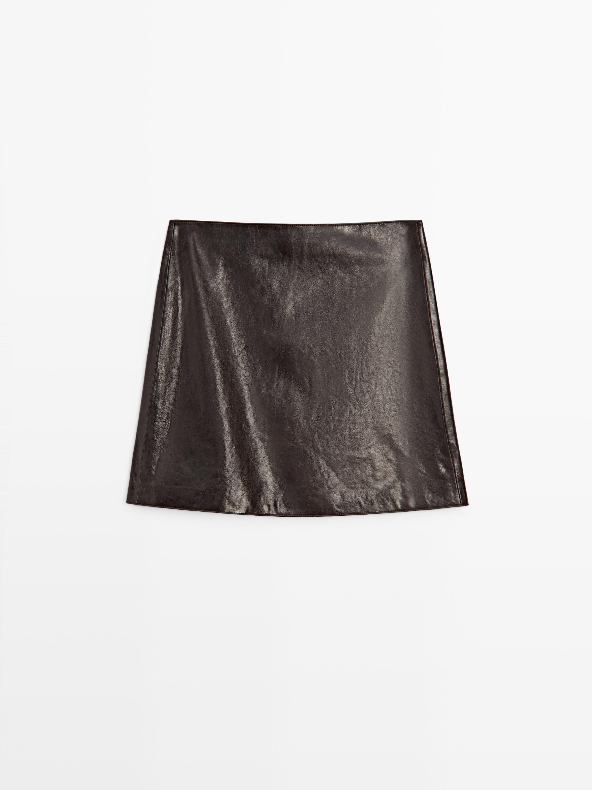 Front view of a short brown skirt with a straight cut and a glossy finish.
