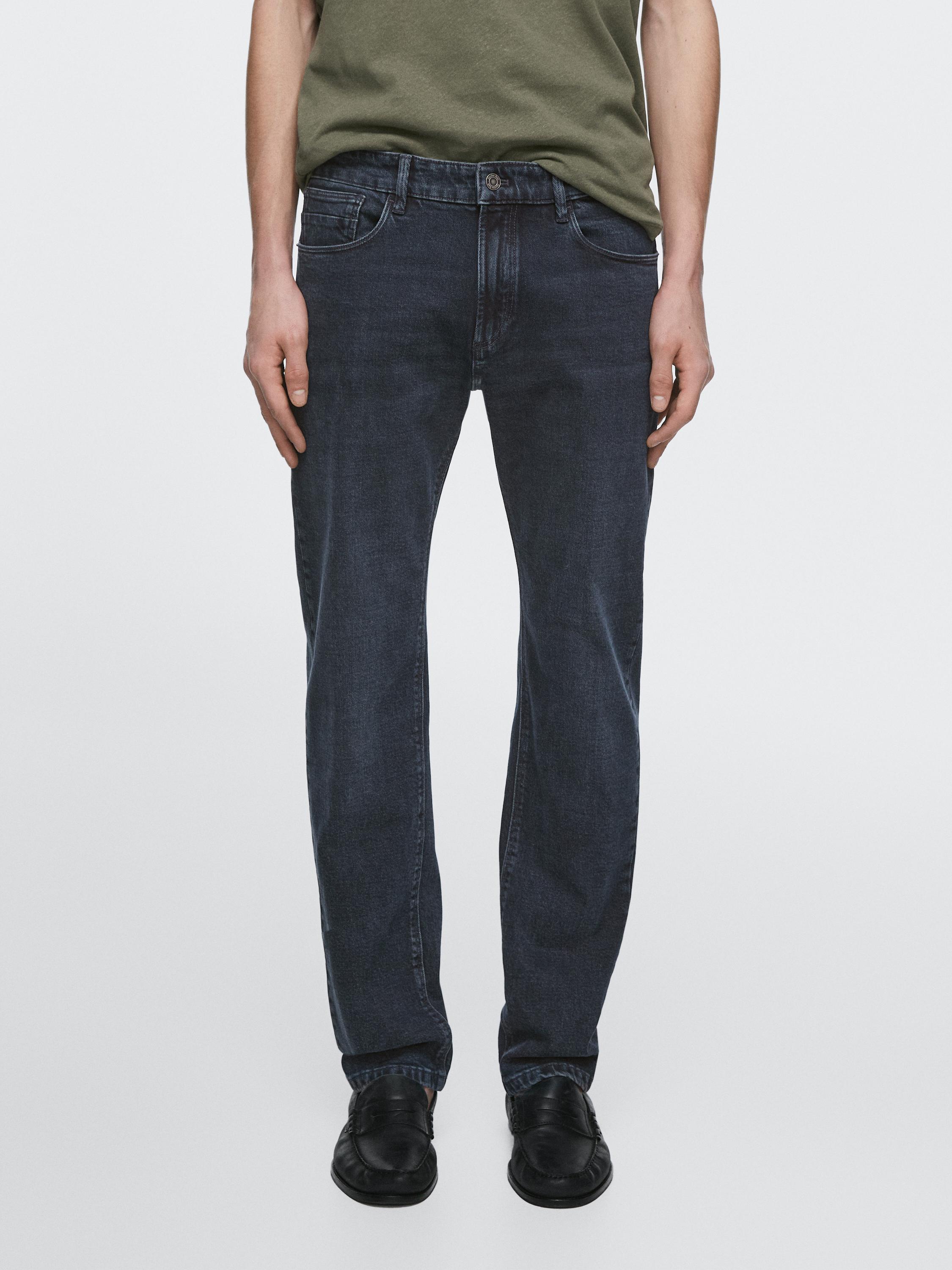 Dark blue slim-fit jeans set with visible front and back pockets.
