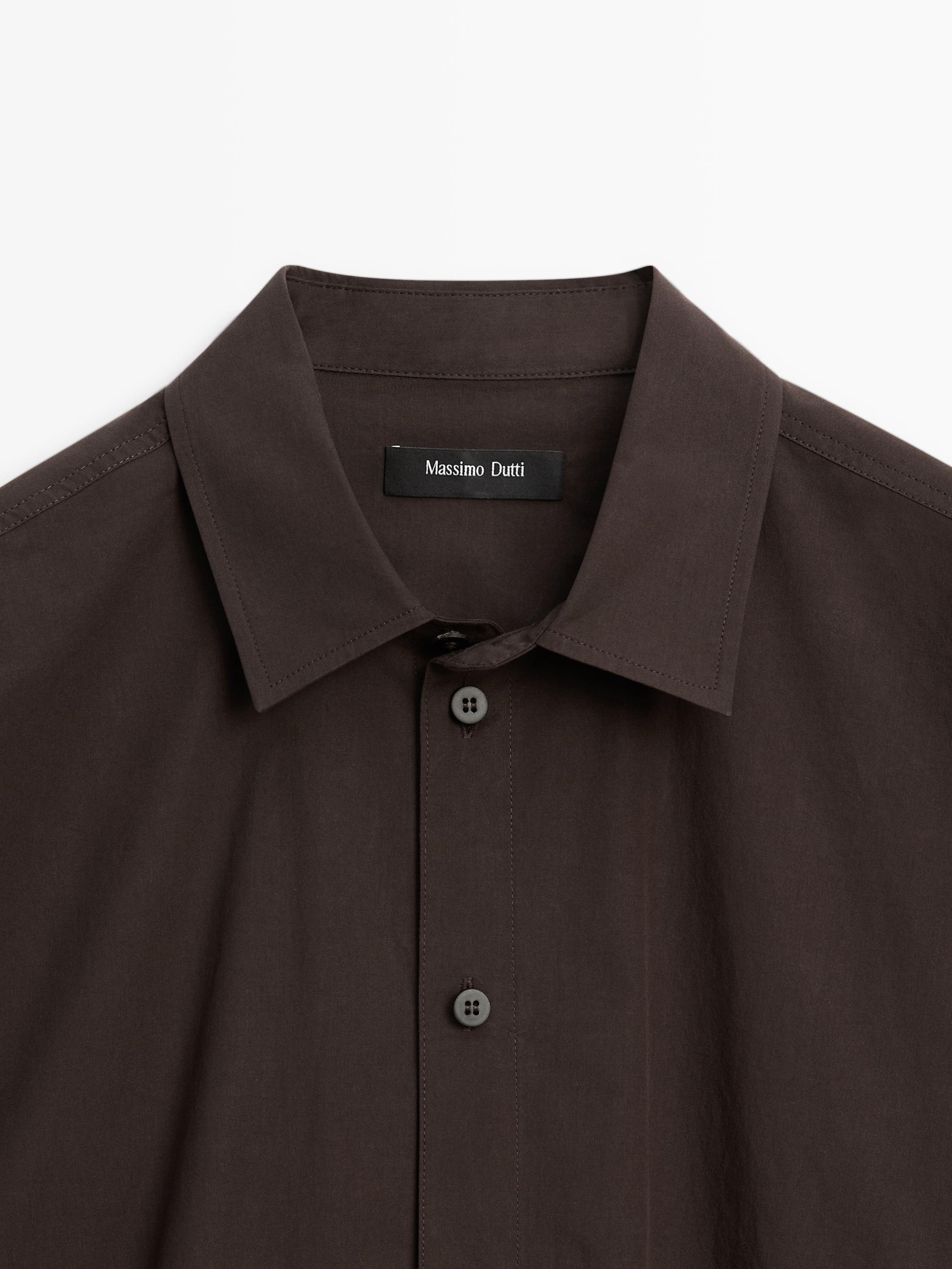 Camisa popelín botonadura asimétrica