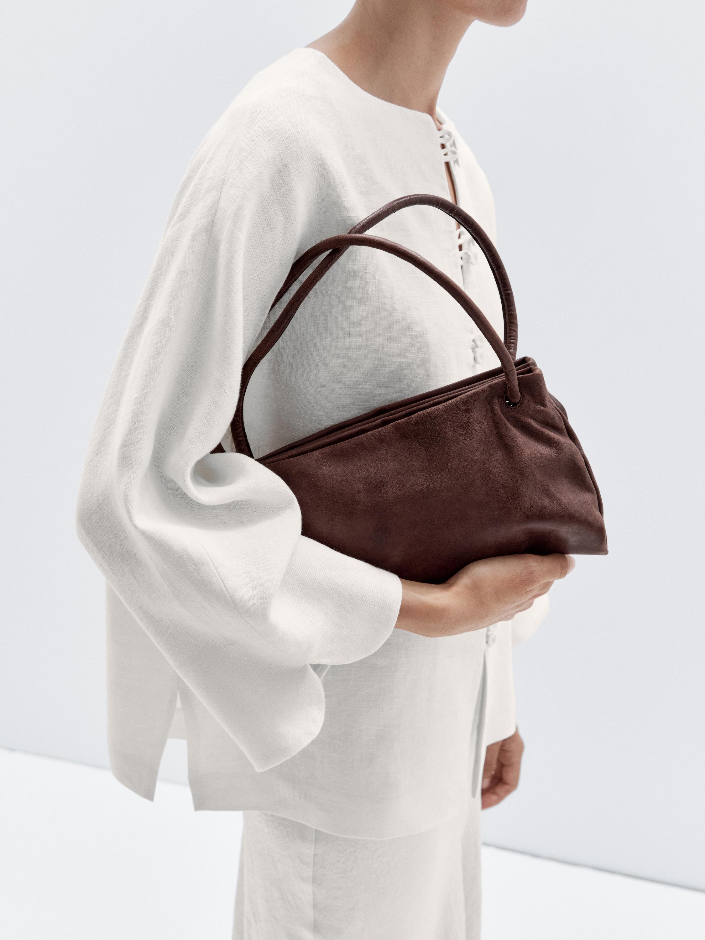 حقيبة صغيرة من جلد النابا بأقسام