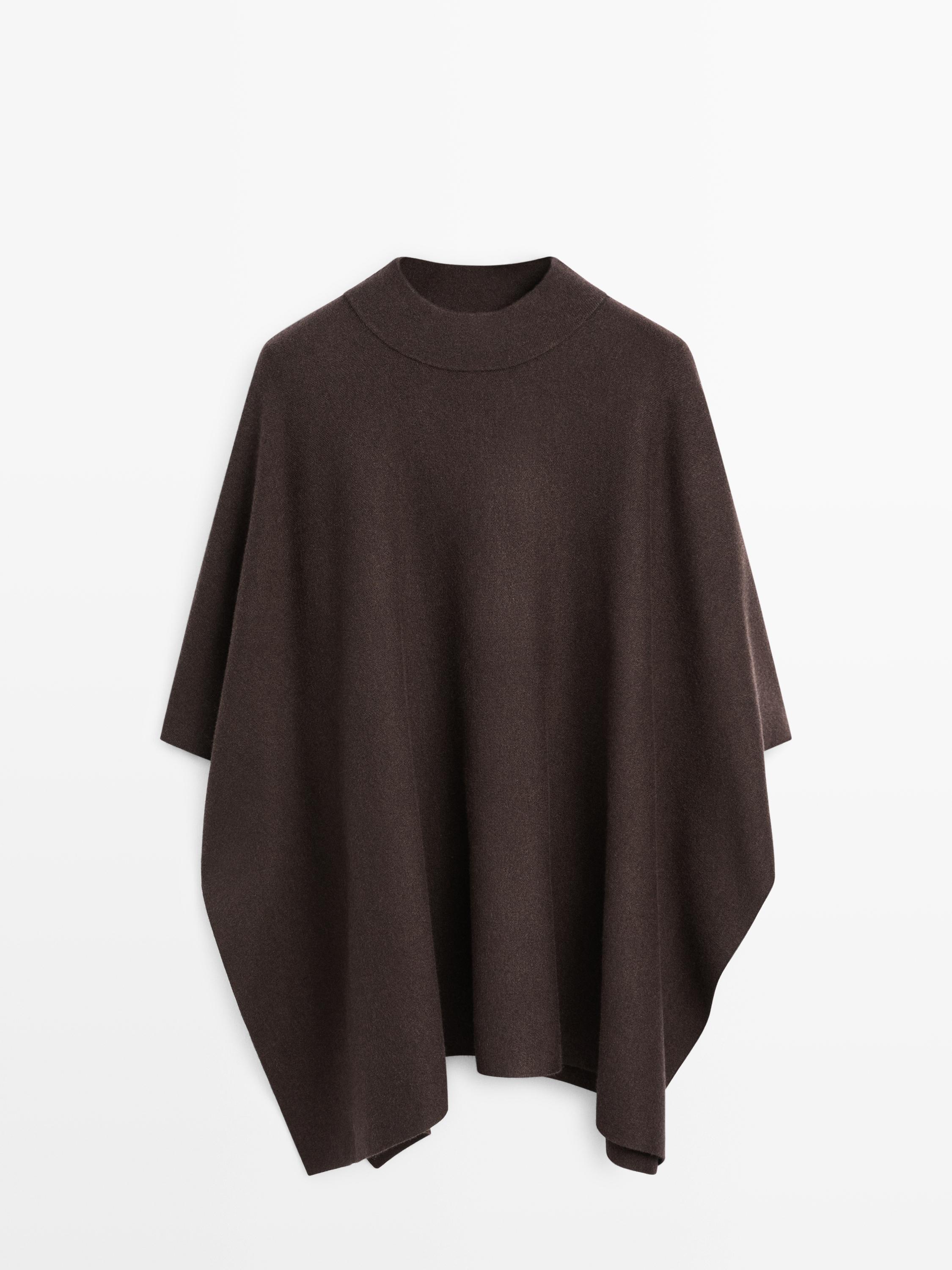 Front view of brown cape with stand-up collar and wide cut.