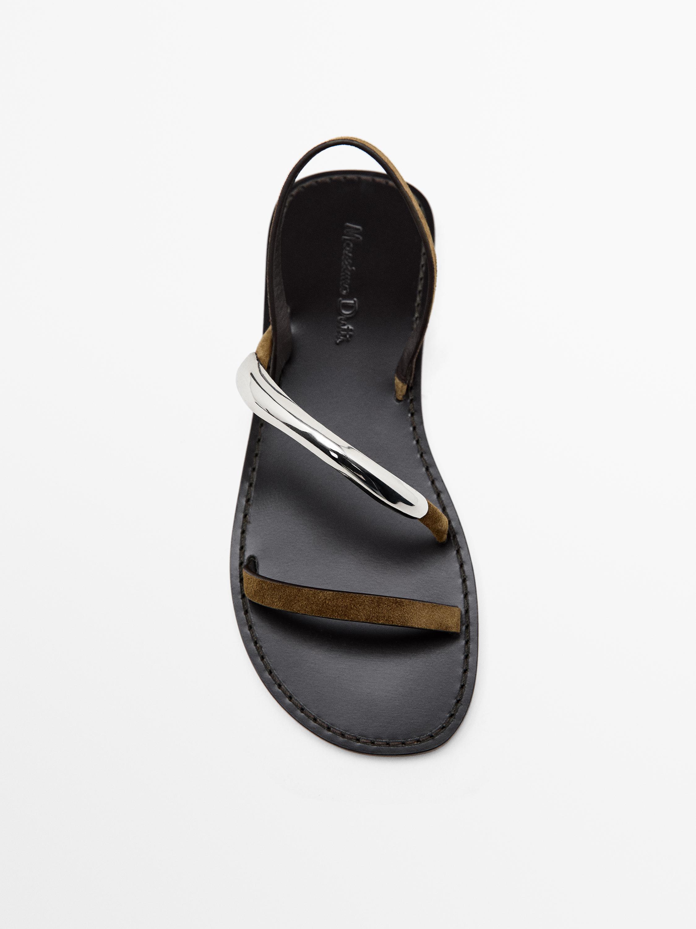 Flat sandals with metallic embellishment
