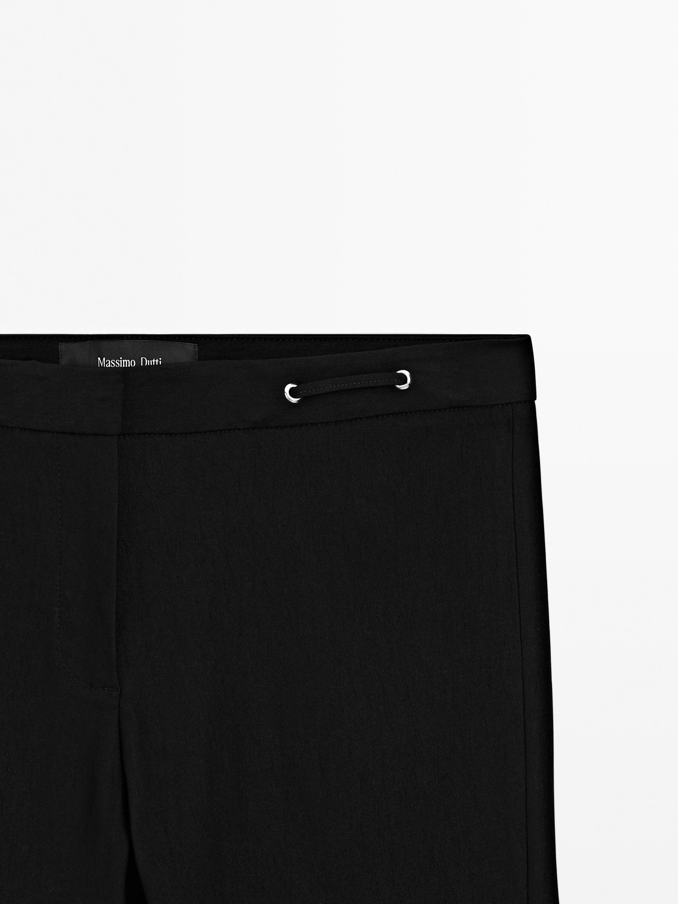 Flared trousers with waist detail