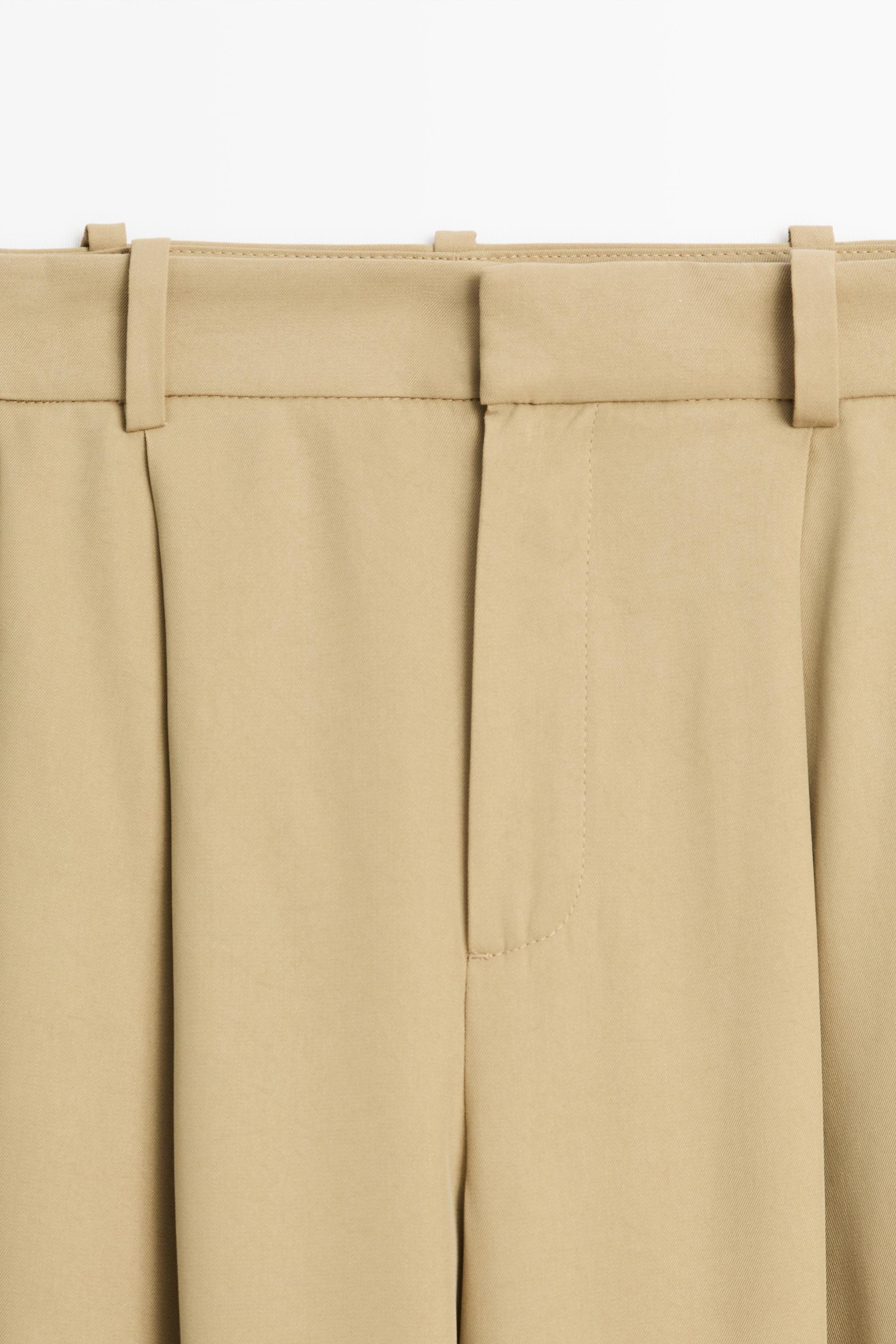 Flowing pleated pants with button detail — BEIGE