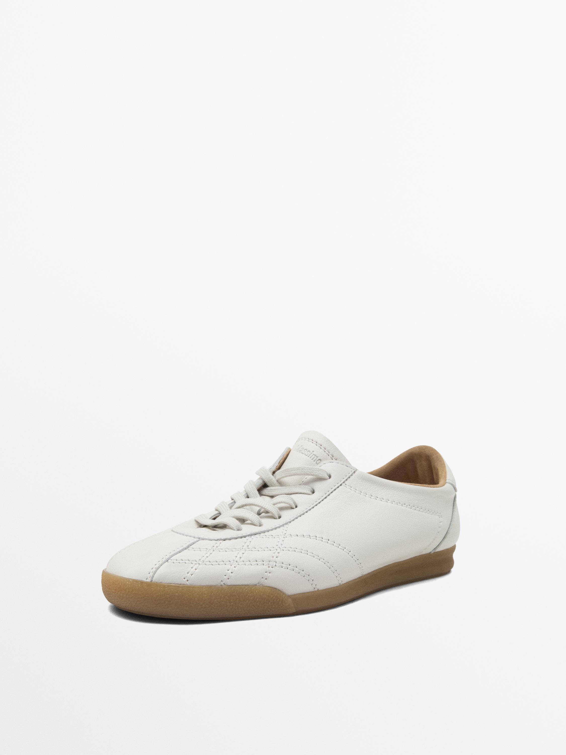 White topstitched trainers