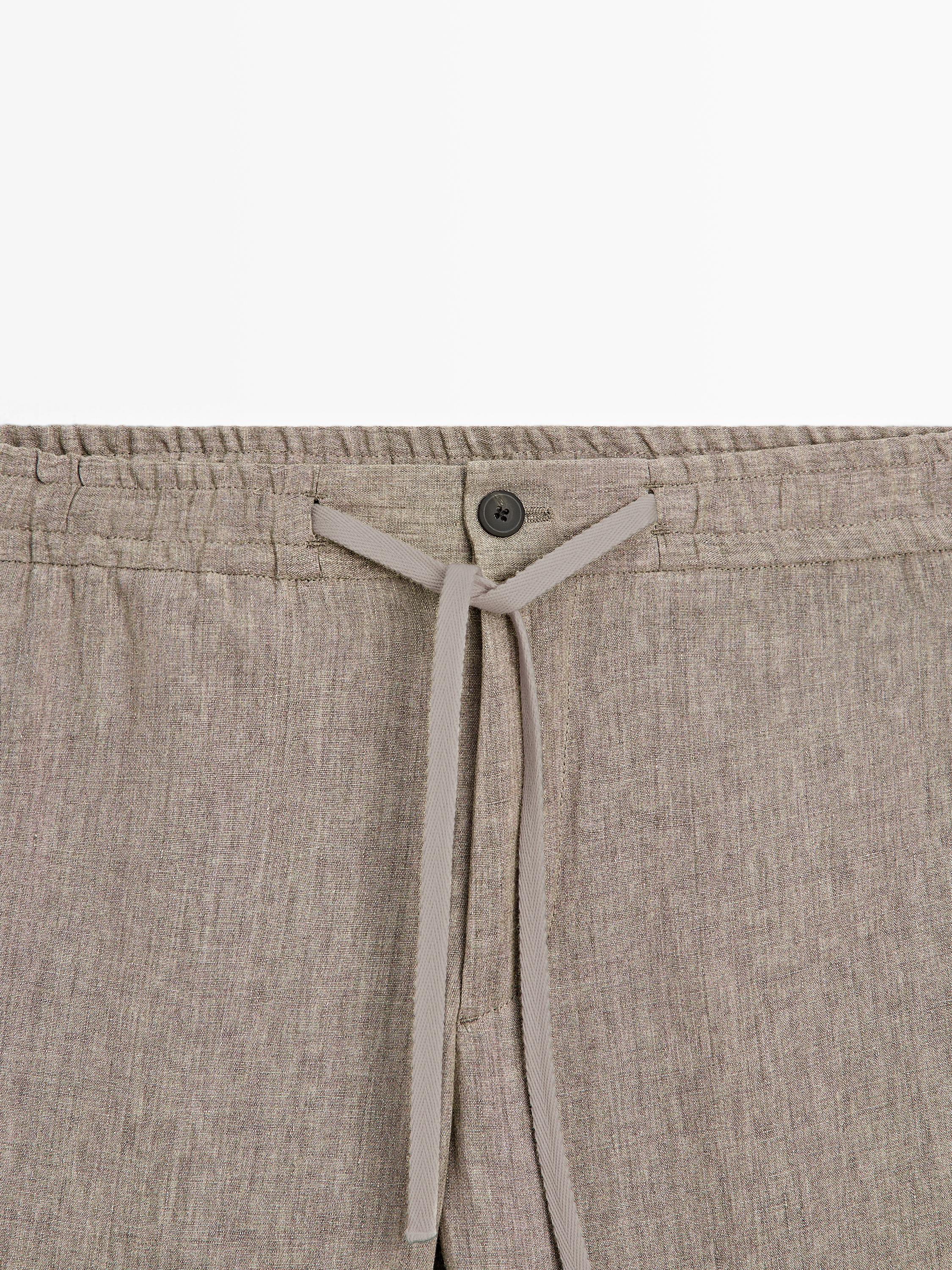 Faded total look linen trousers