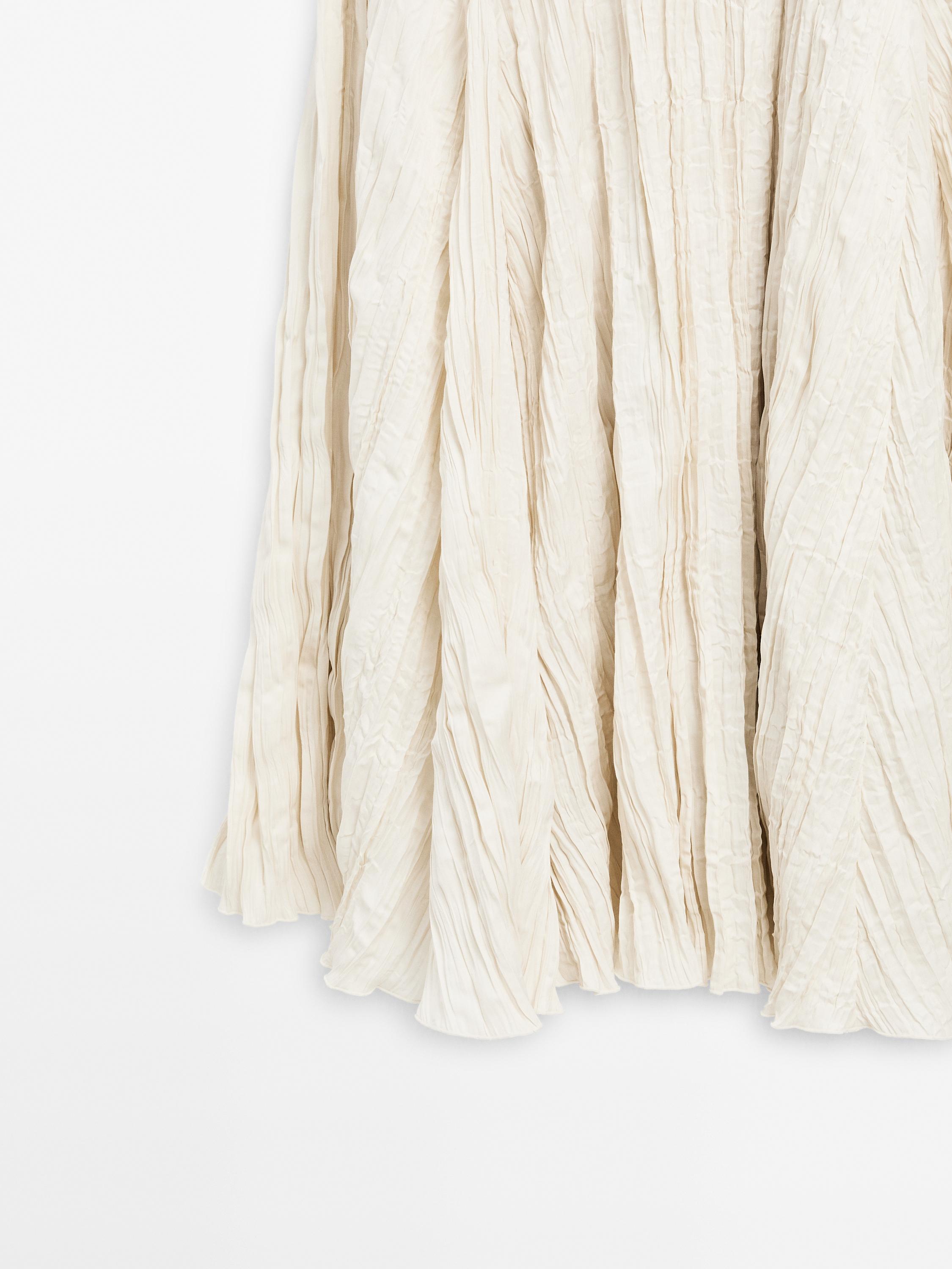 Long dress with godets and pleated detail