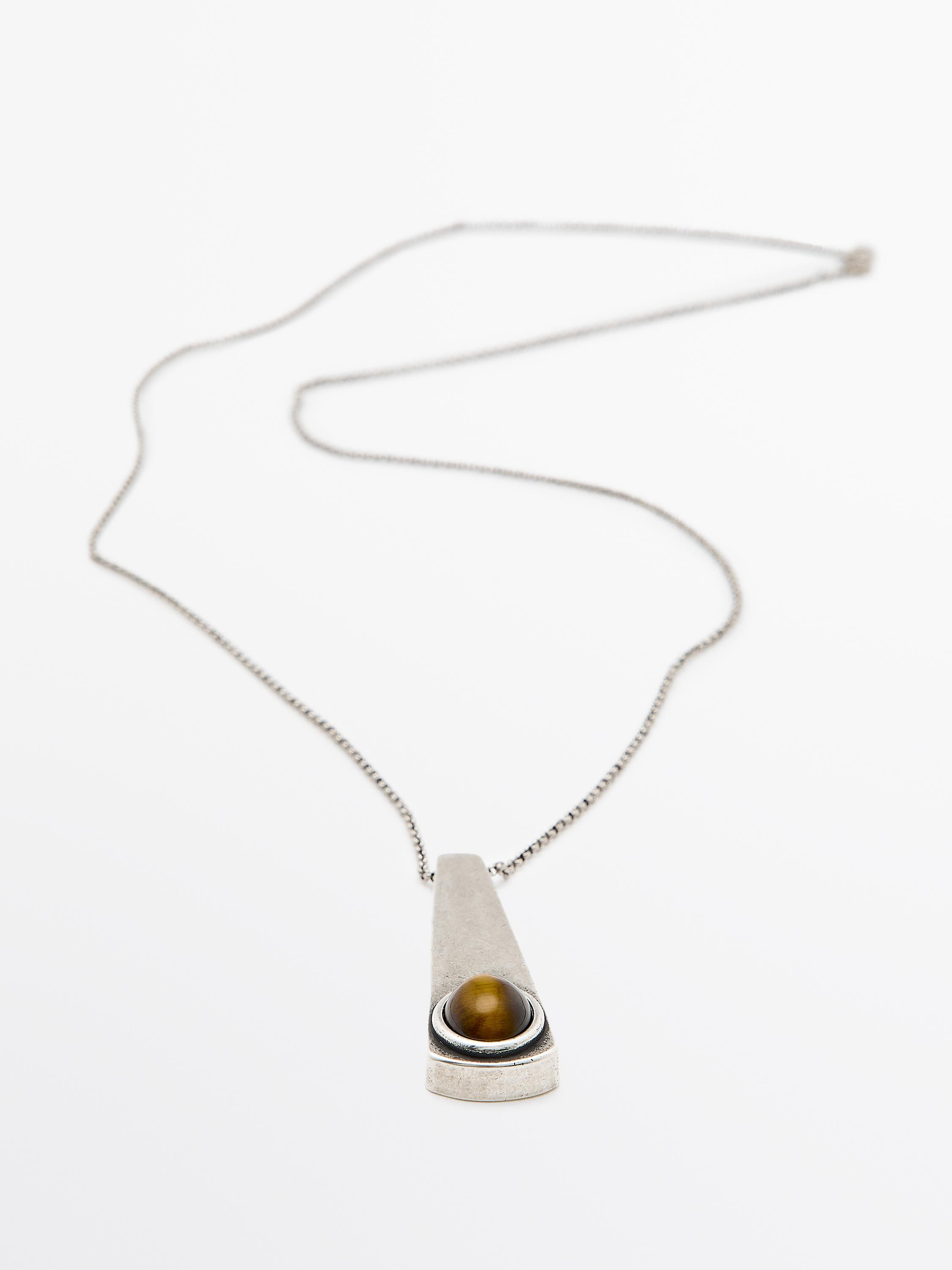 Geometric pendant with stone