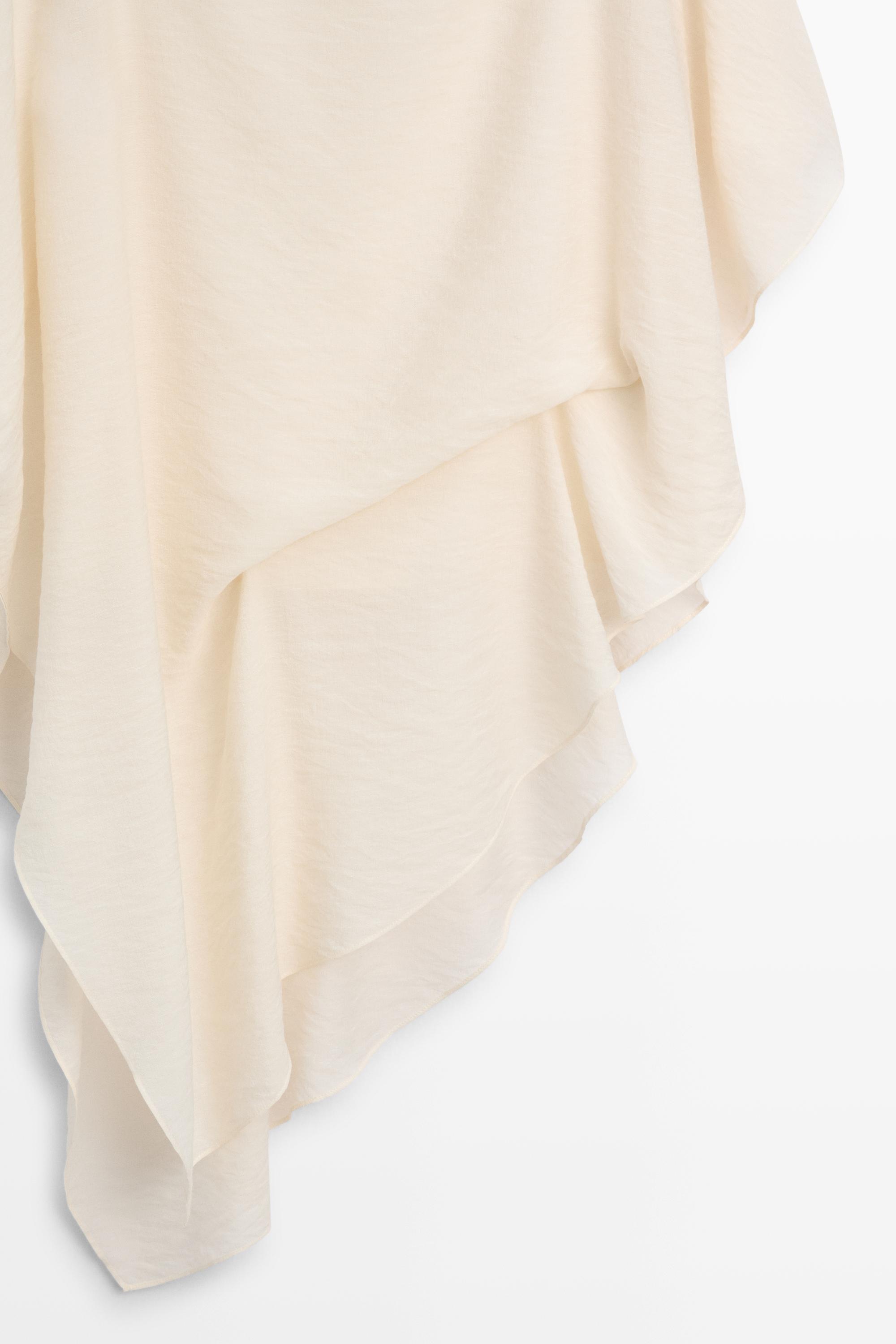 Asymmetric cape-style flowing blouse — Off white