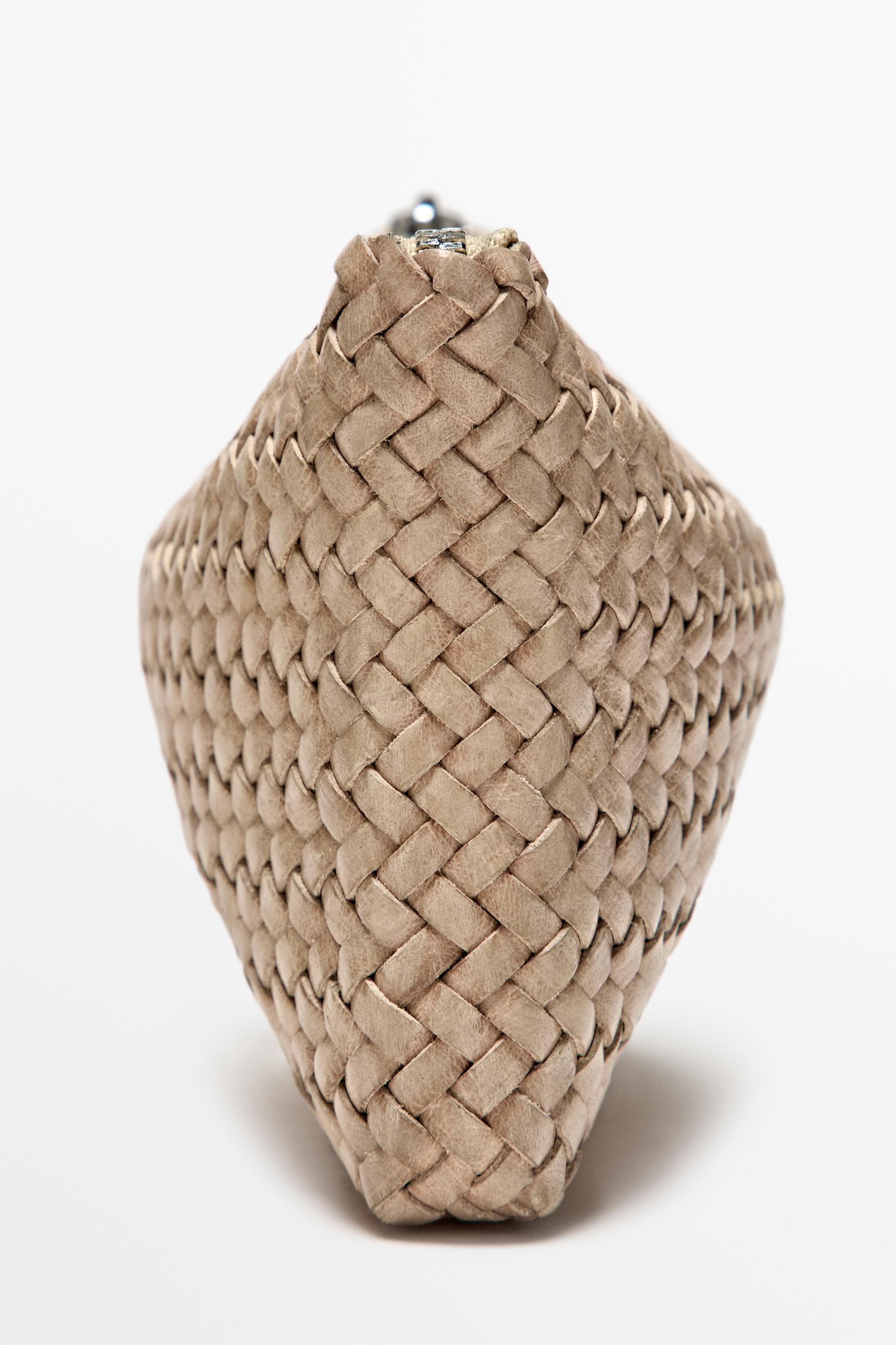 Braided nappa leather pouch bag — CREAM