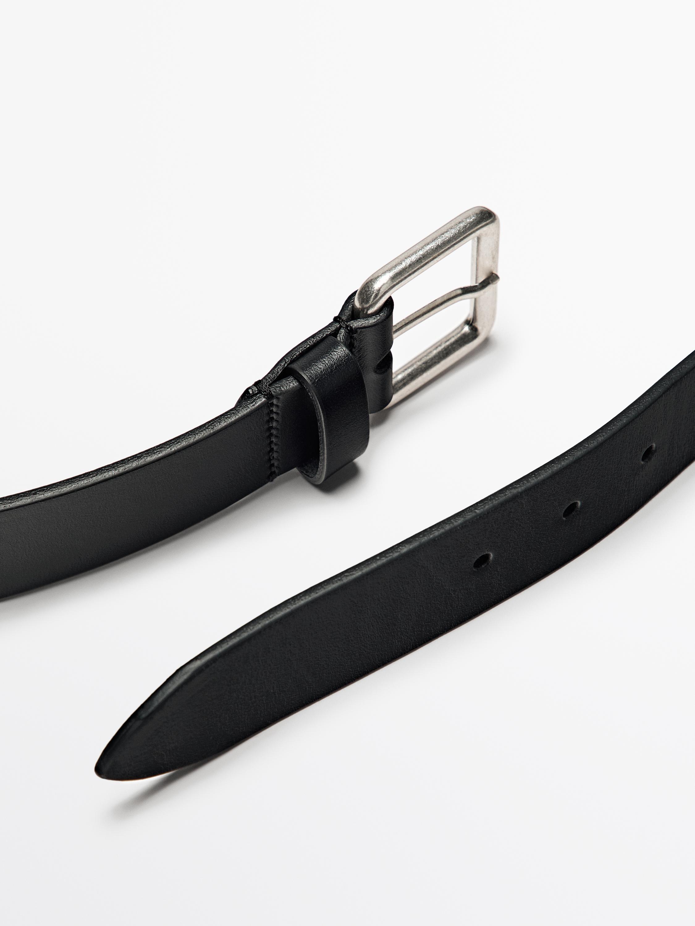 Leather belt with metallic buckle