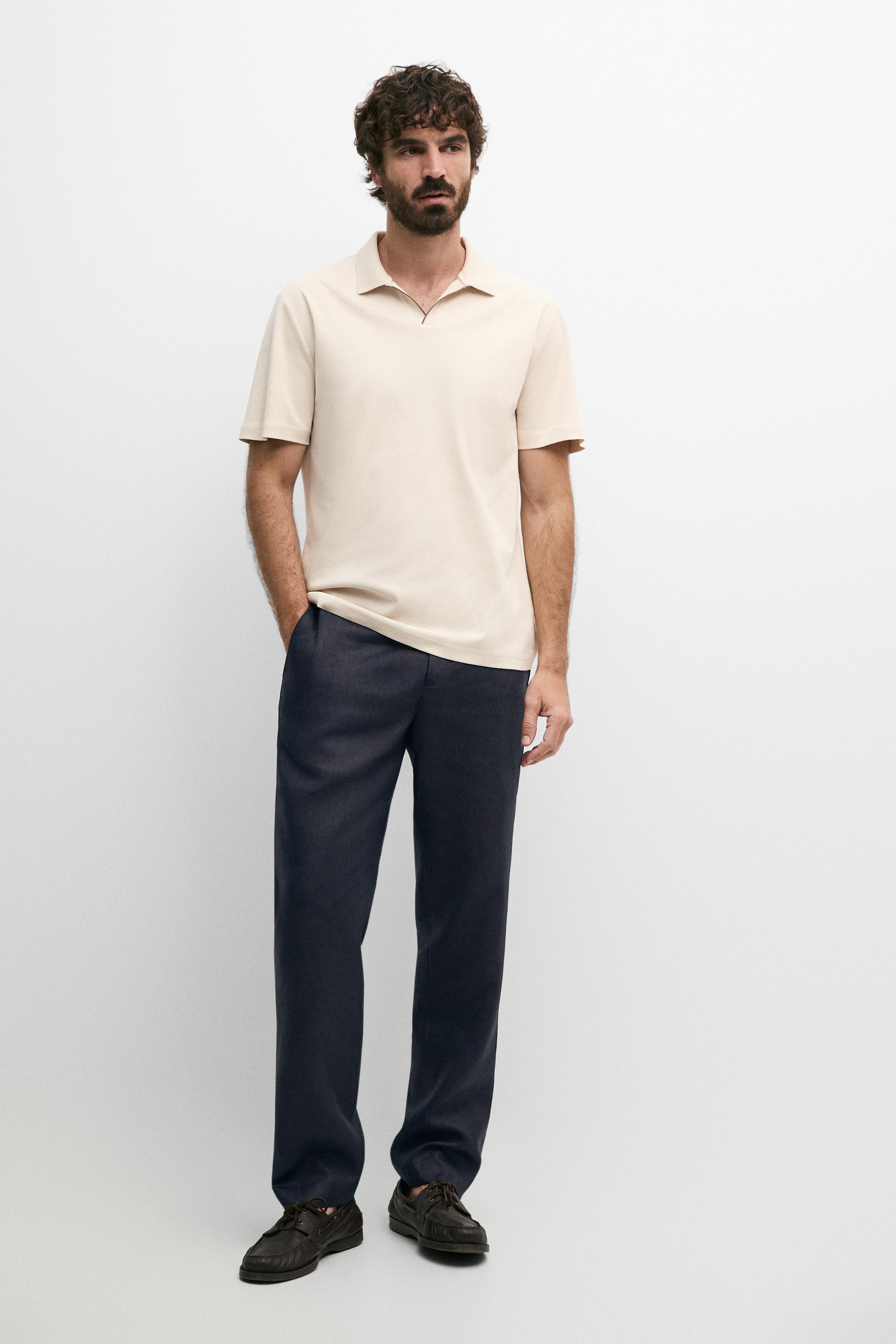 Kaus polo campuran katun dengan tepian kontras