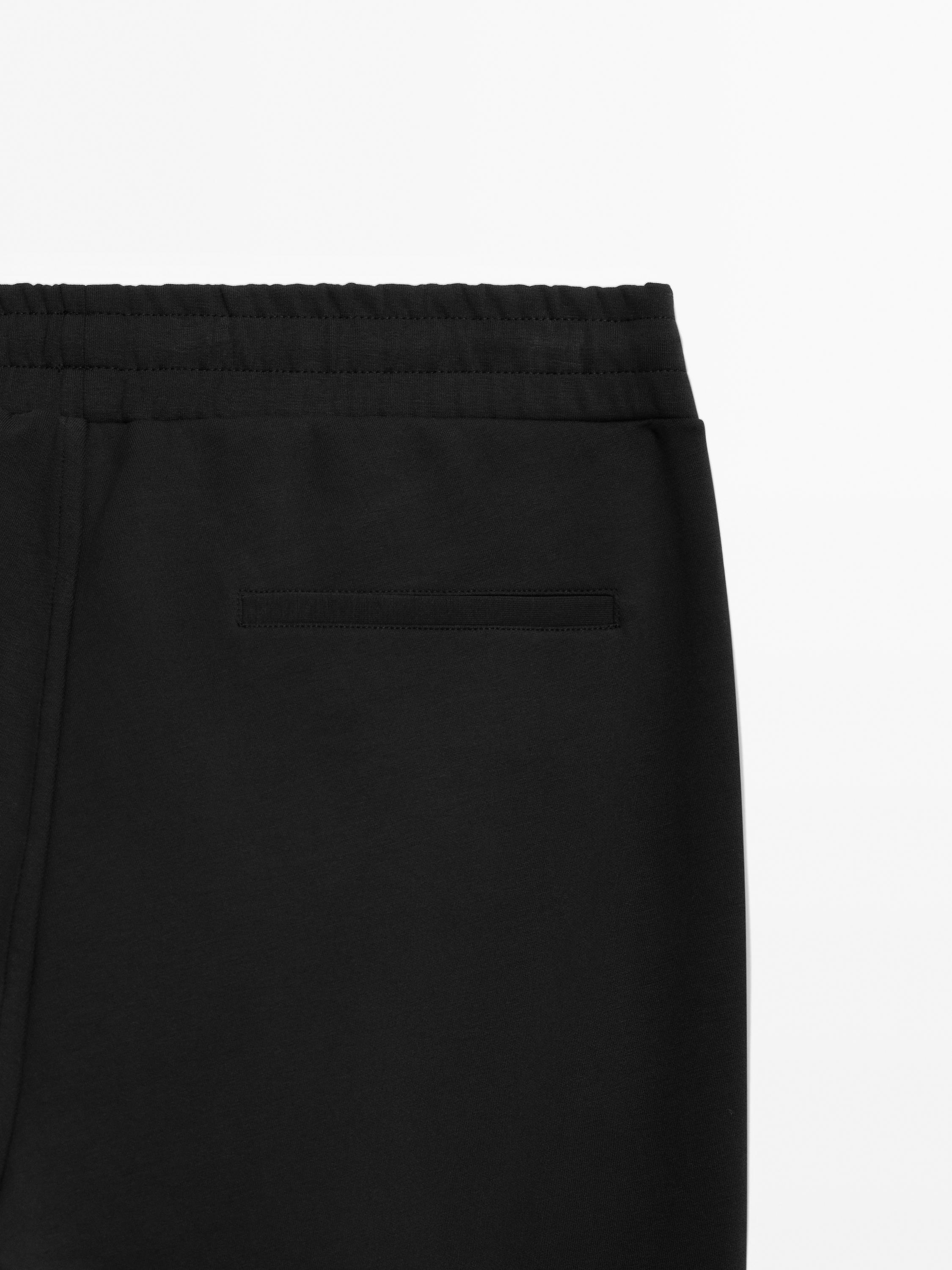 Trousers with side pocket detail