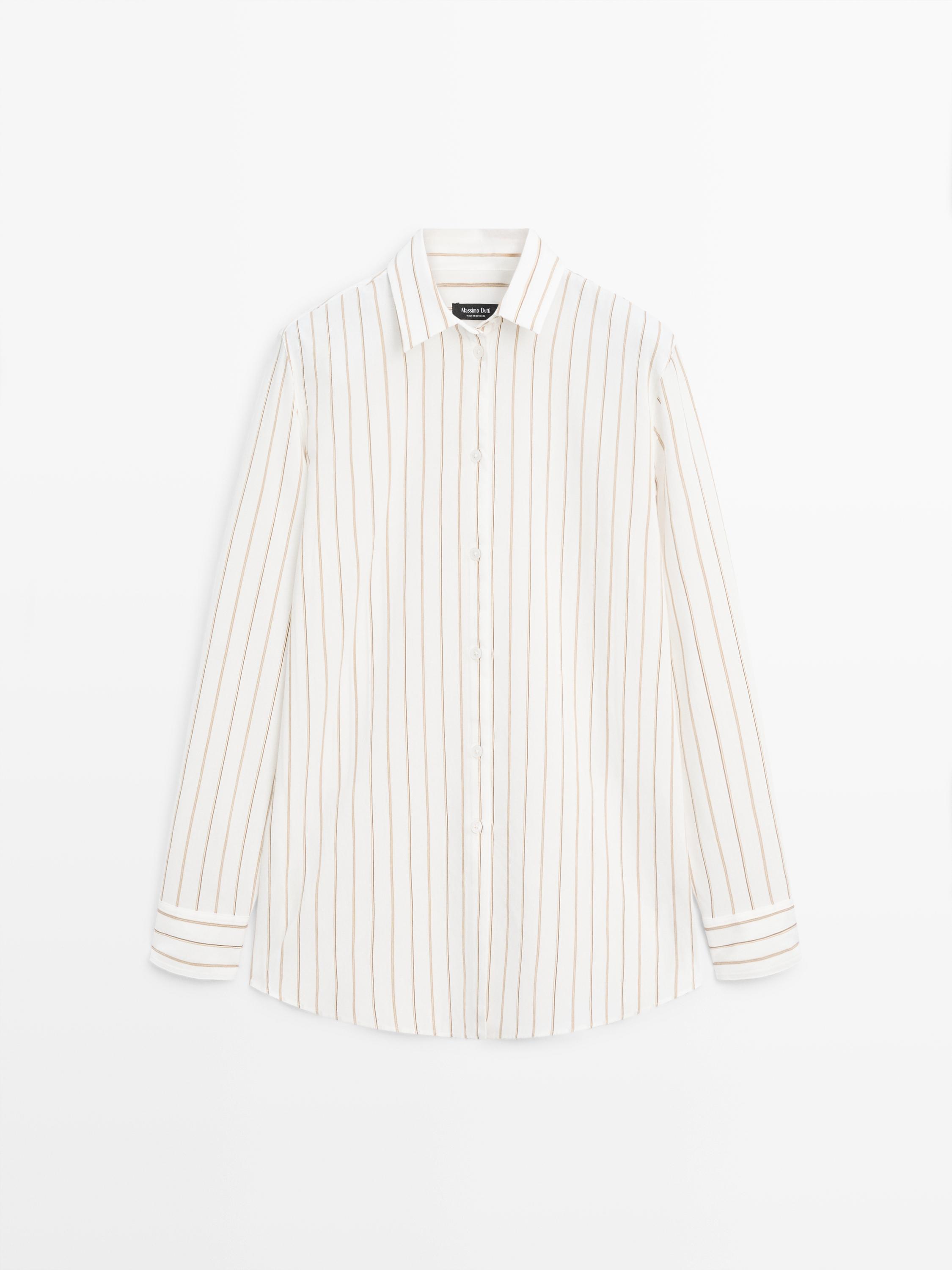 Front view of a white shirt with tricolor stripes, classic collar, and central button placket. Long sleeves with buttoned cuffs.