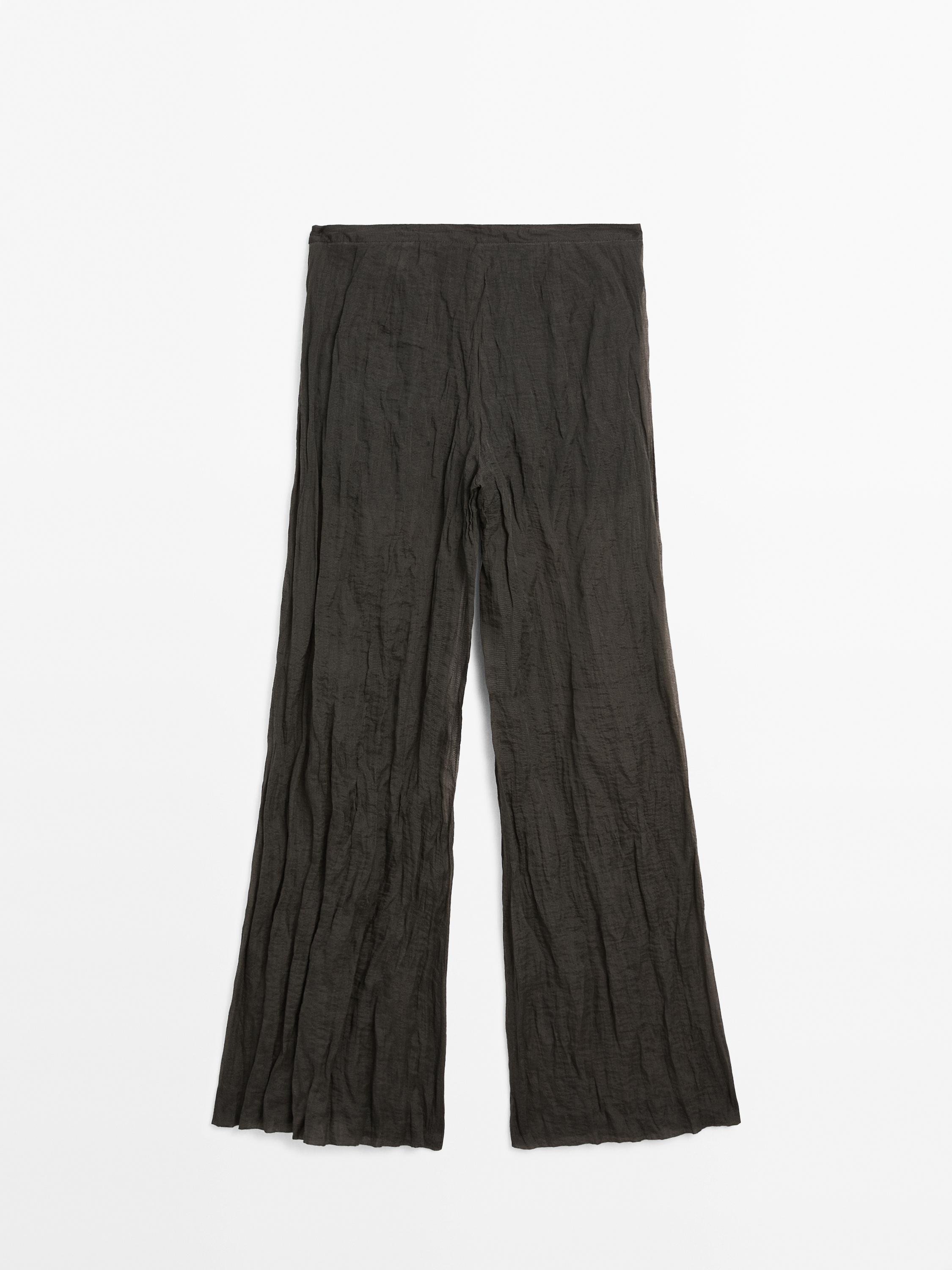 Creased-effect flowing trousers - Limited Edition