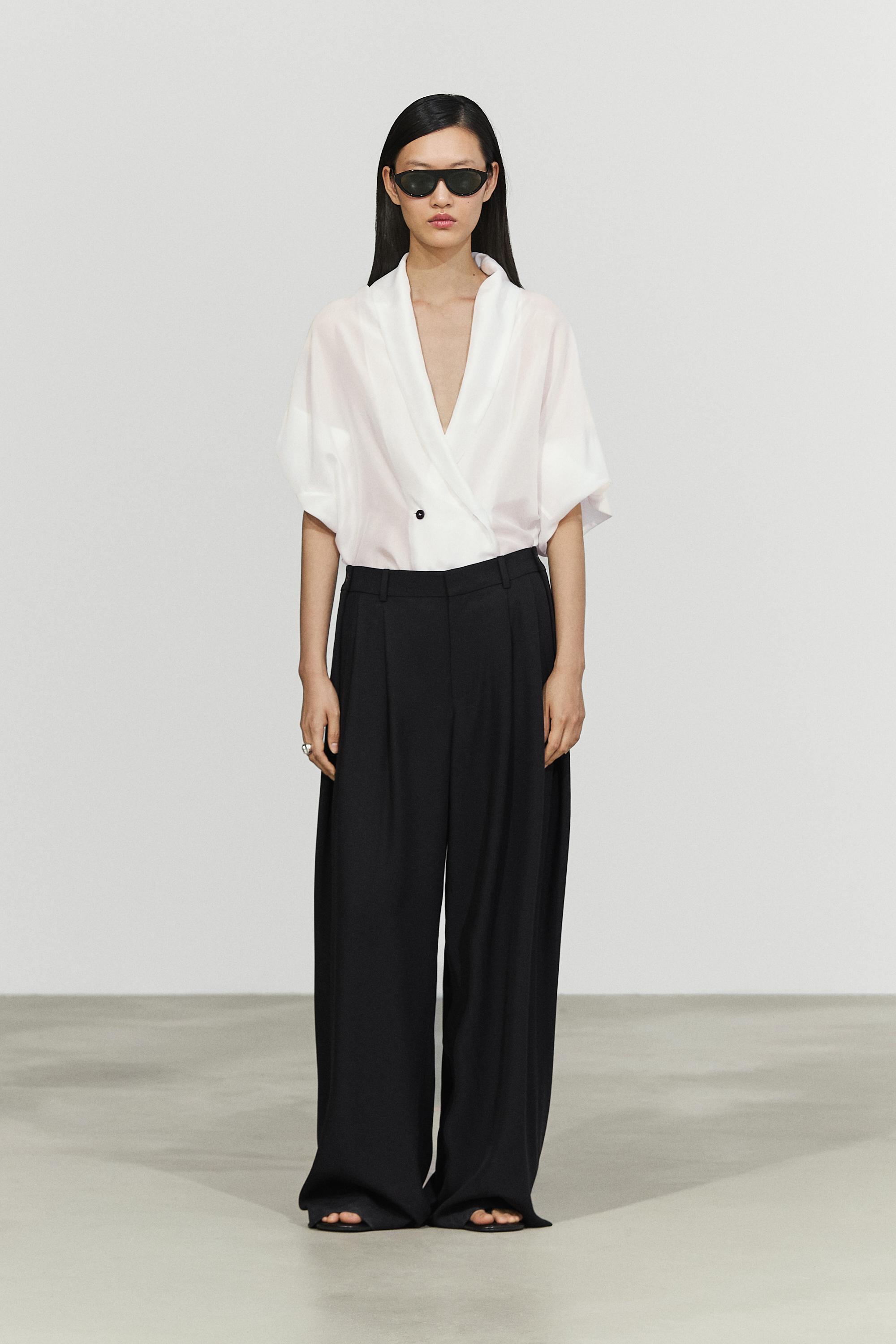 Flowing pleated pants with button detail — BLACK