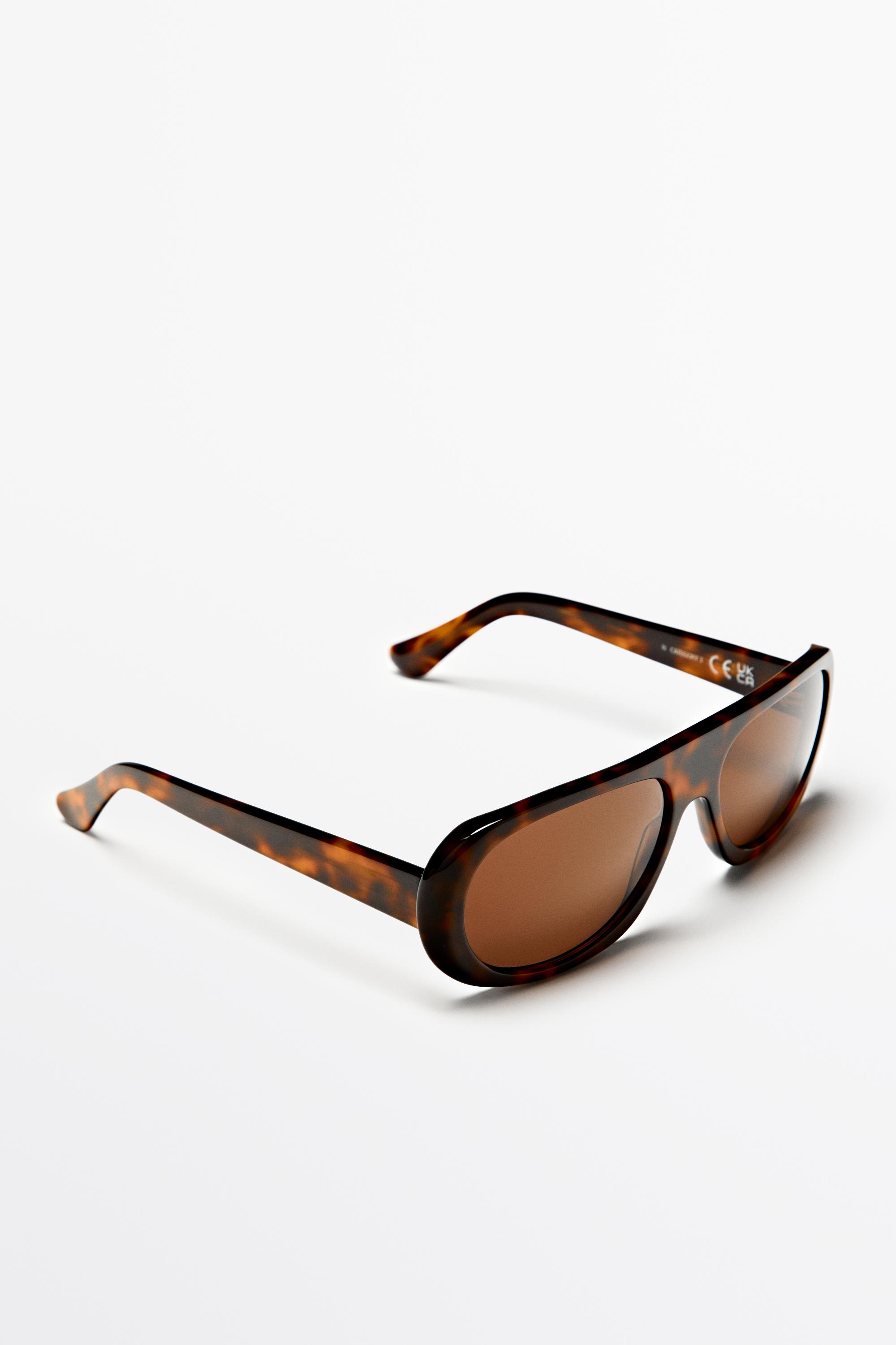 Oval tortoiseshell-effect sunglasses — BROWN