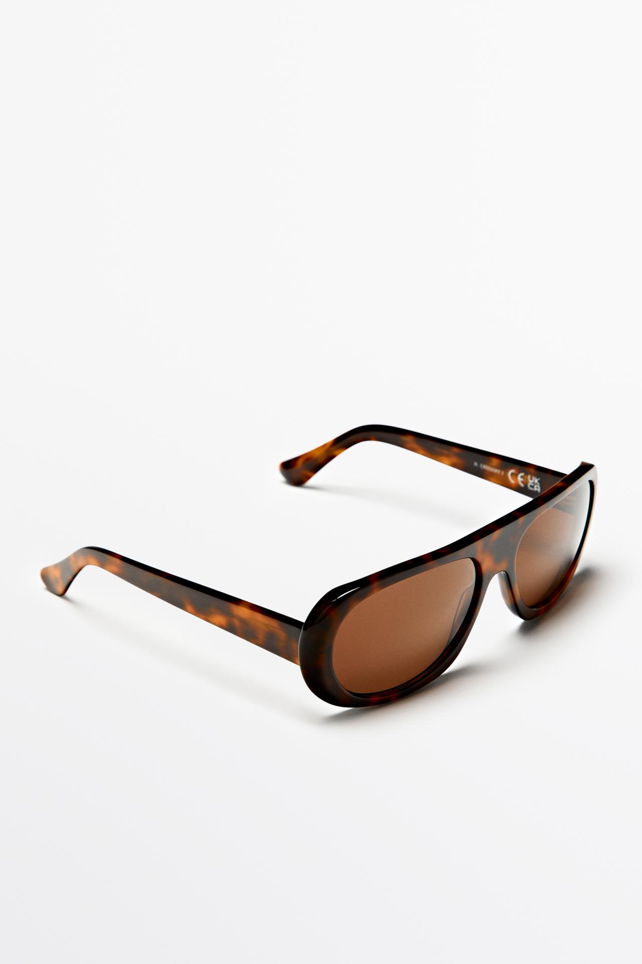 Oval tortoiseshell-effect sunglasses — BROWN