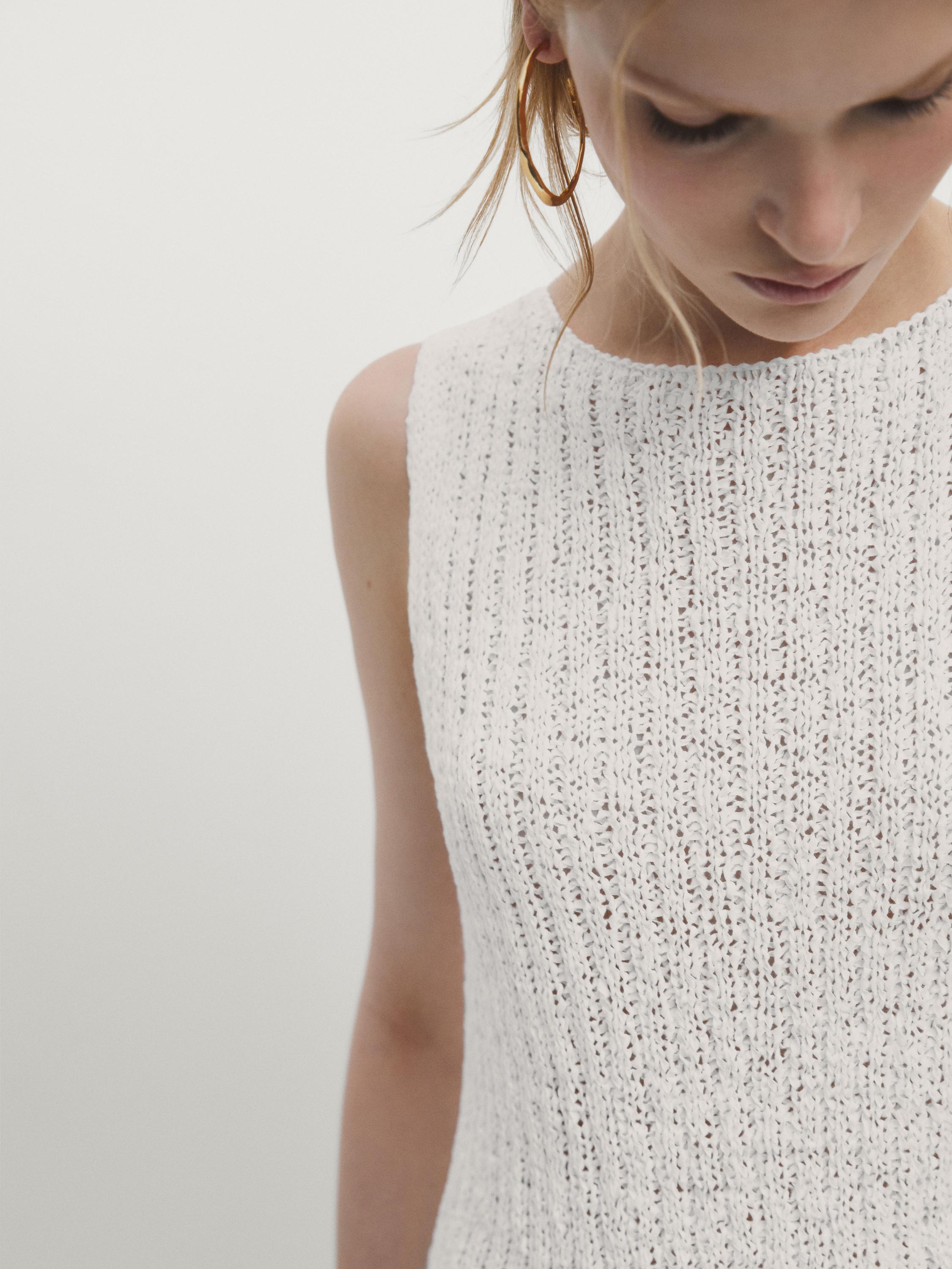 Knit top with asymmetric hem