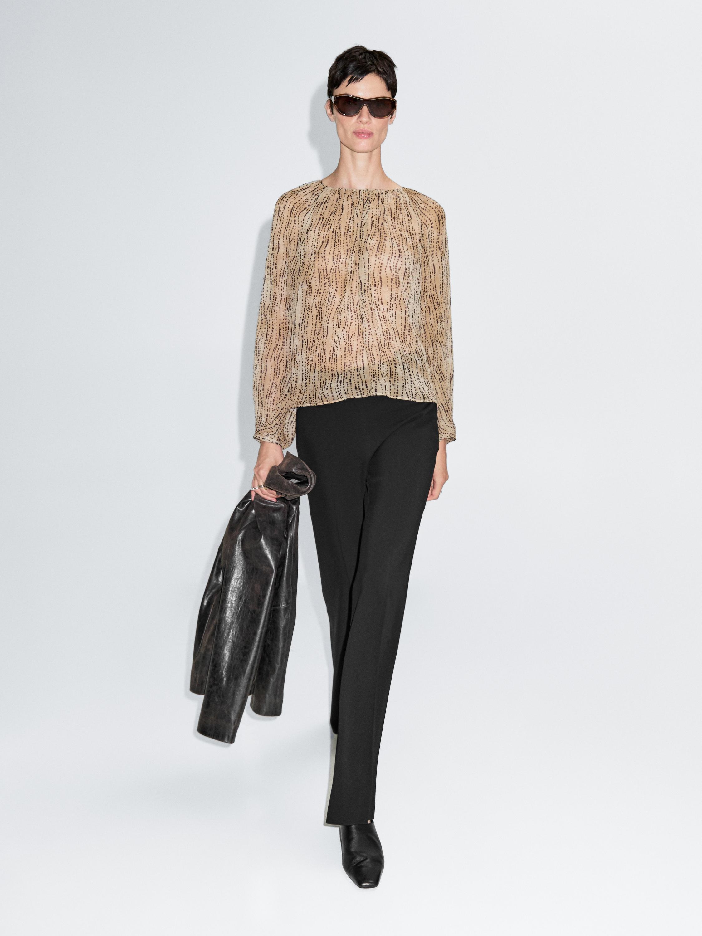 Semi-sheer draped blouse