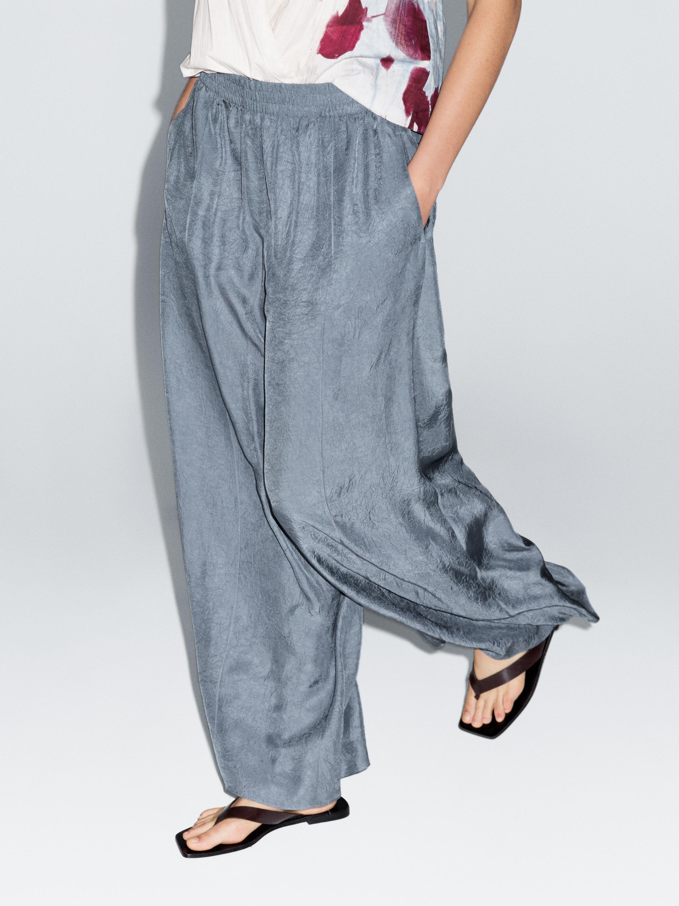 Creased-effect loose-fitting trousers