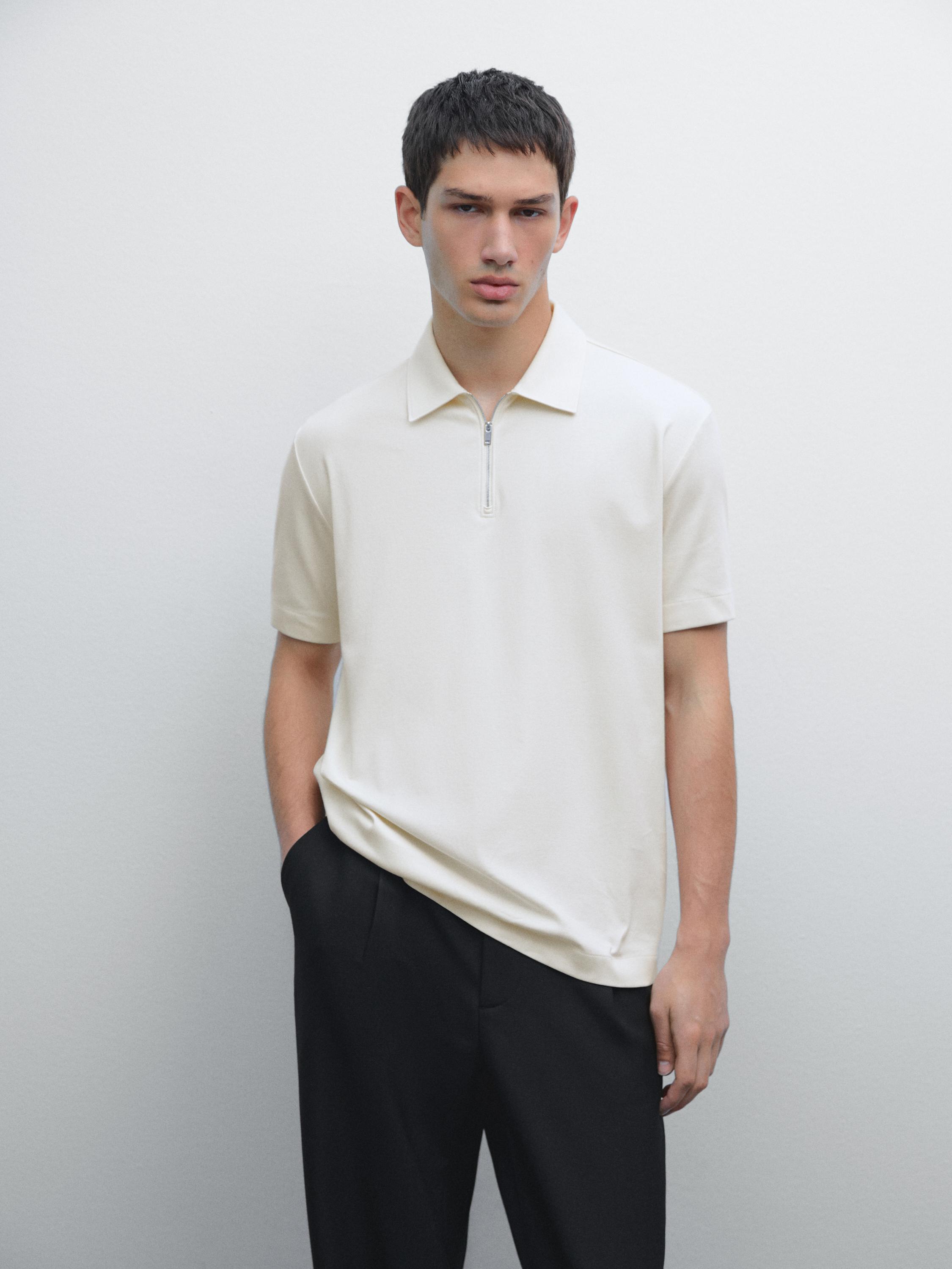 Ensemble polo blanc zippé et pantalon noir
