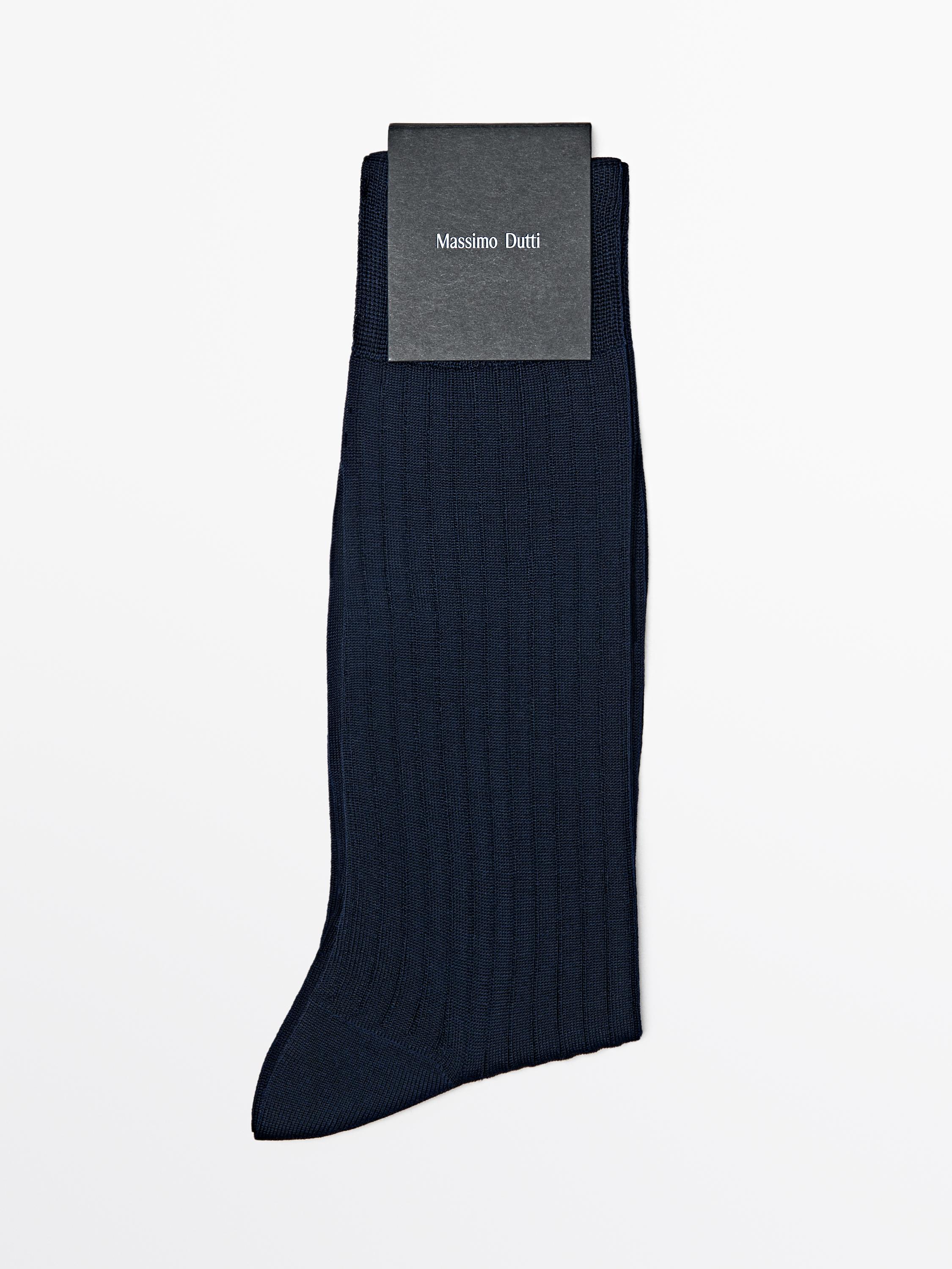 Front view of navy blue ribbed socks. Visible text: "Massimo Dutti".