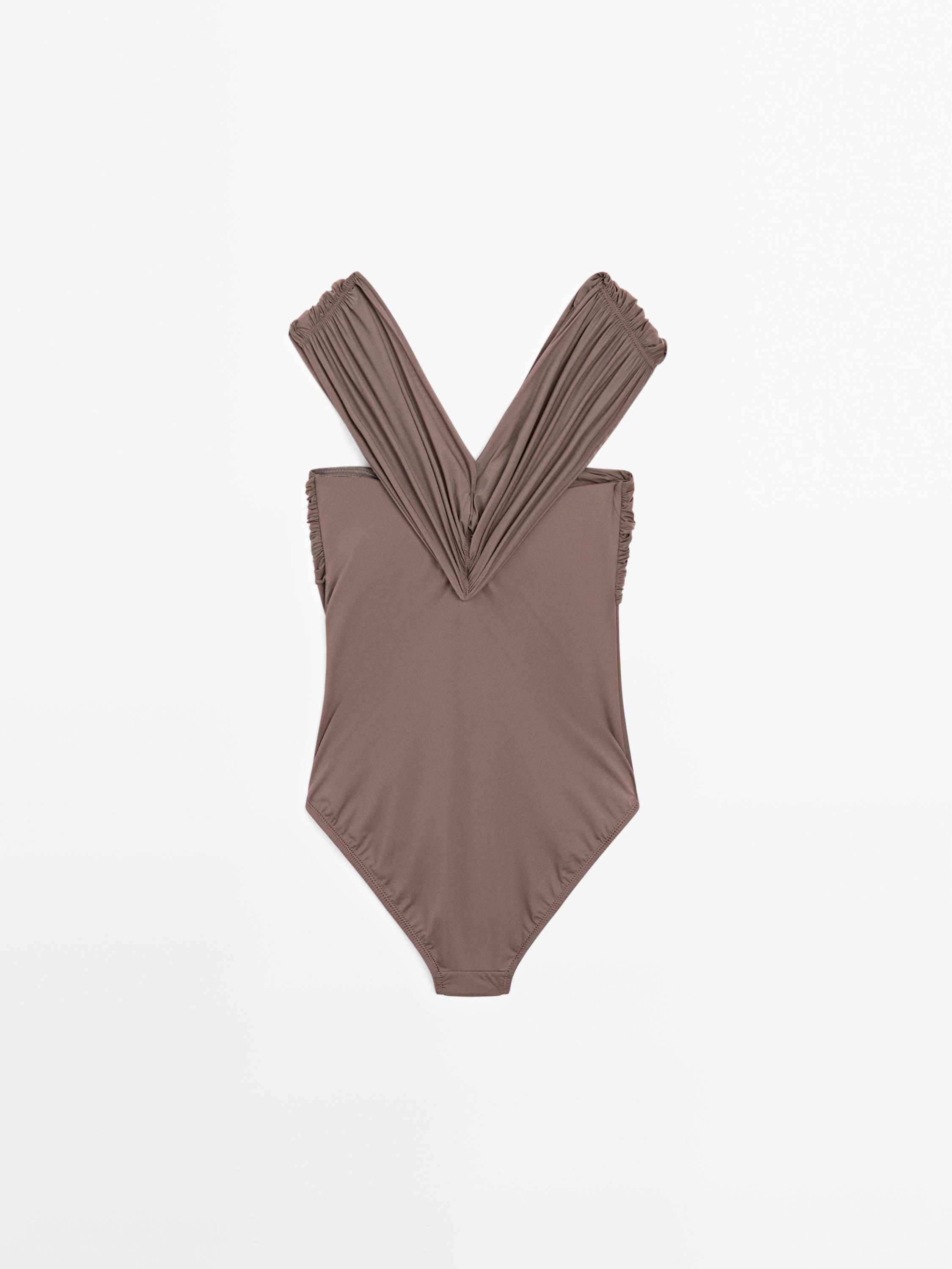 Bandeau swimsuit with criss-cross straps