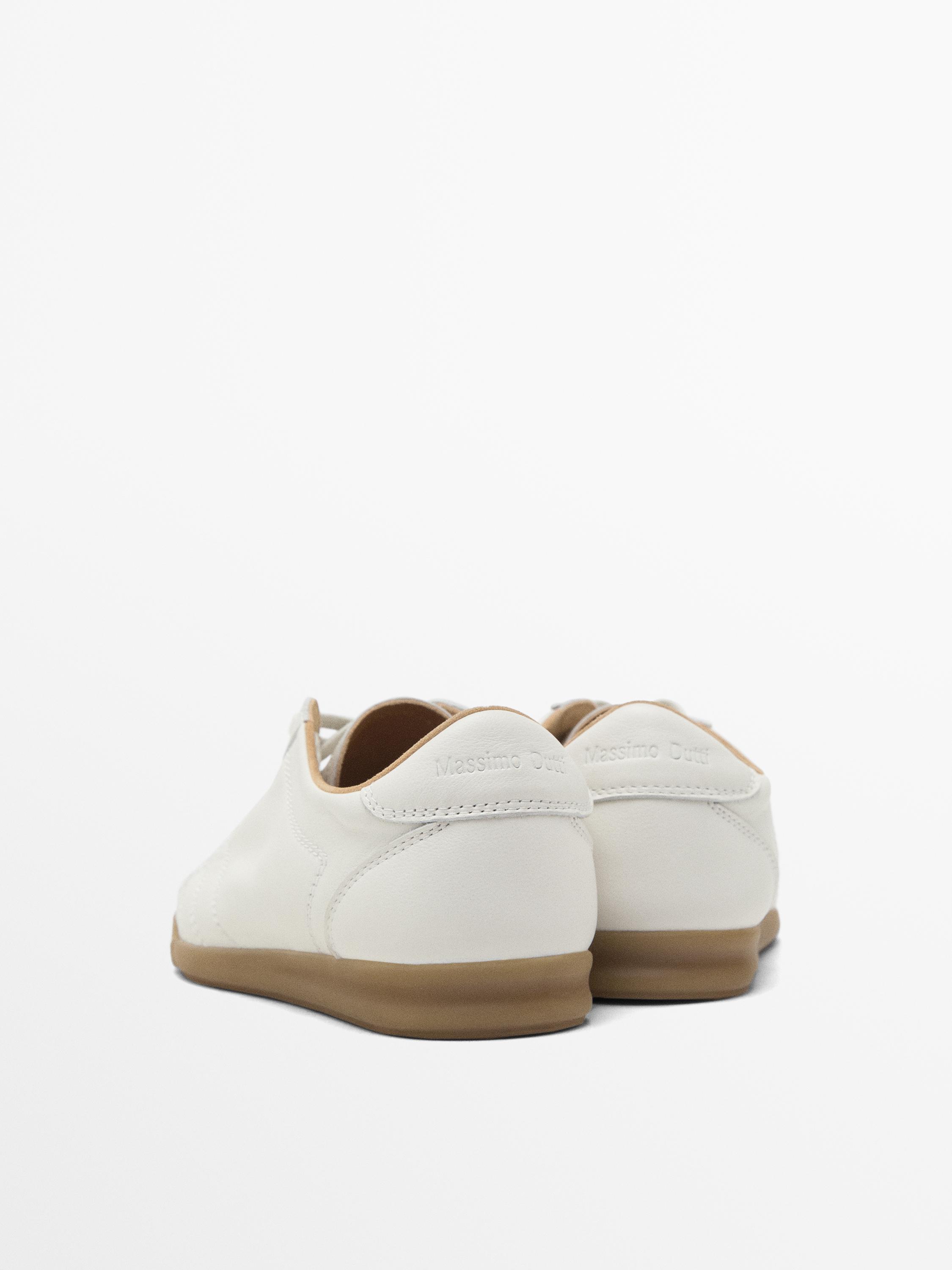 White topstitched trainers
