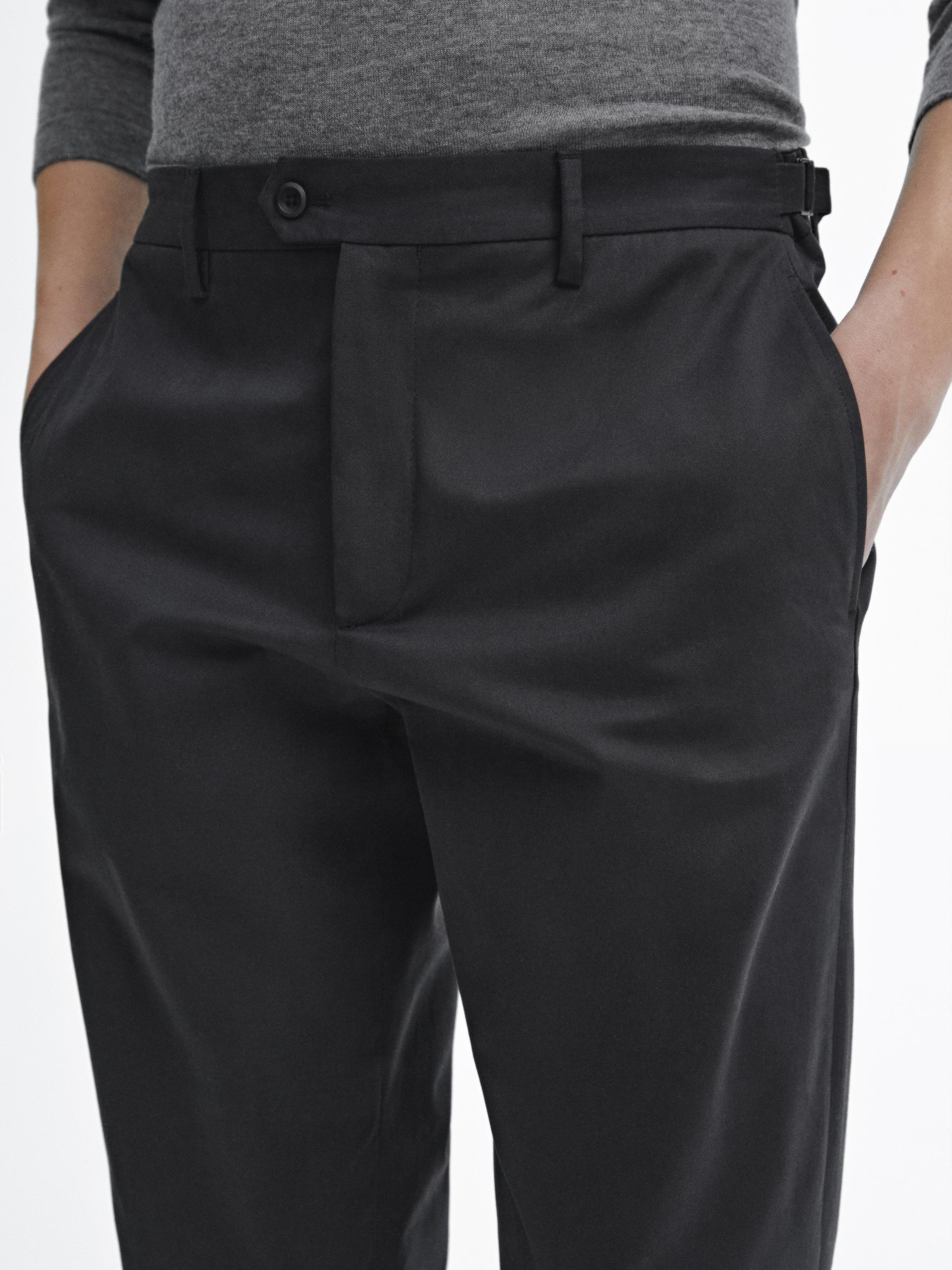 Tapered fit trousers with buckle detail