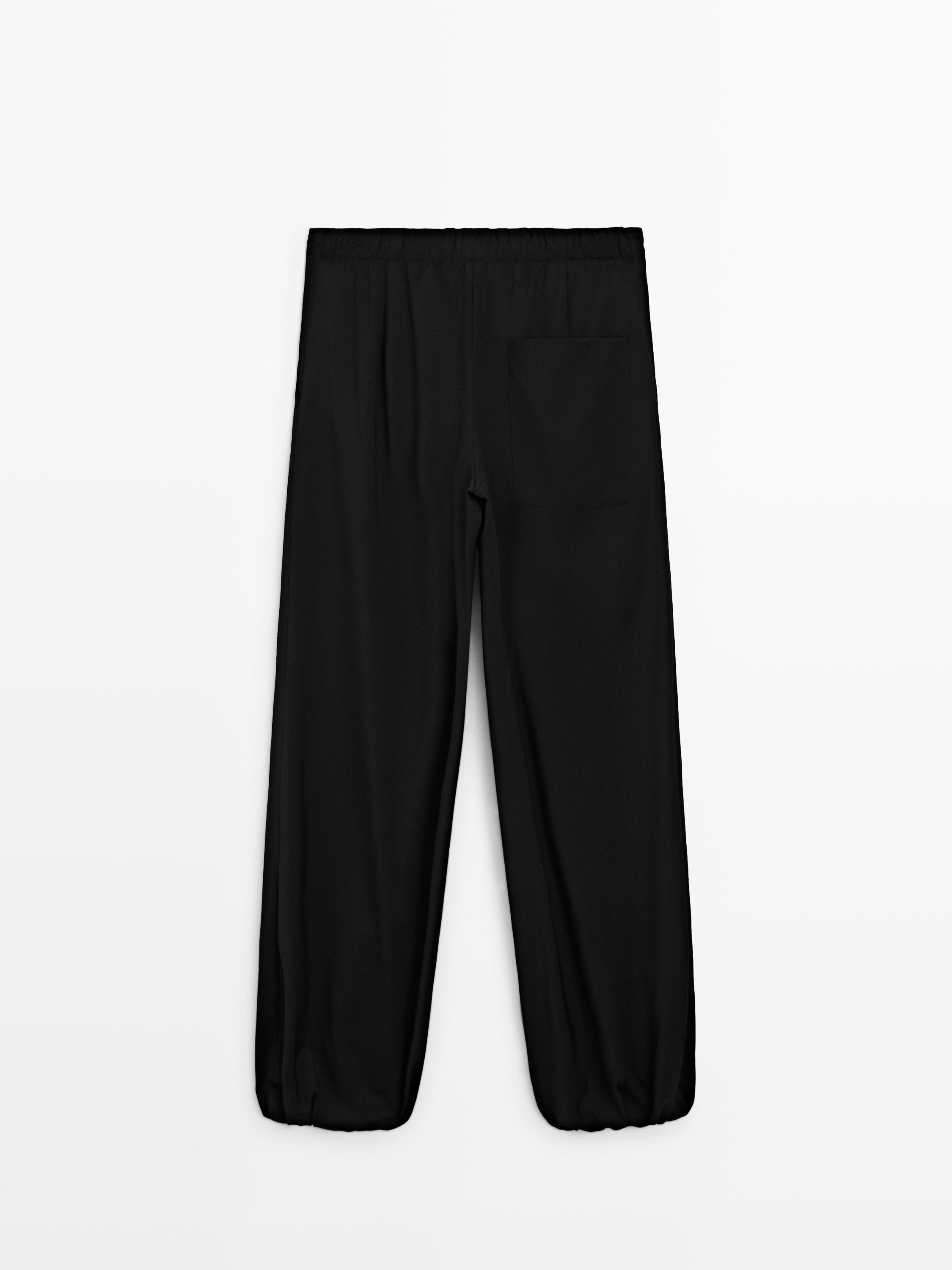 Wool sarouel trousers with tie detail — BLACK