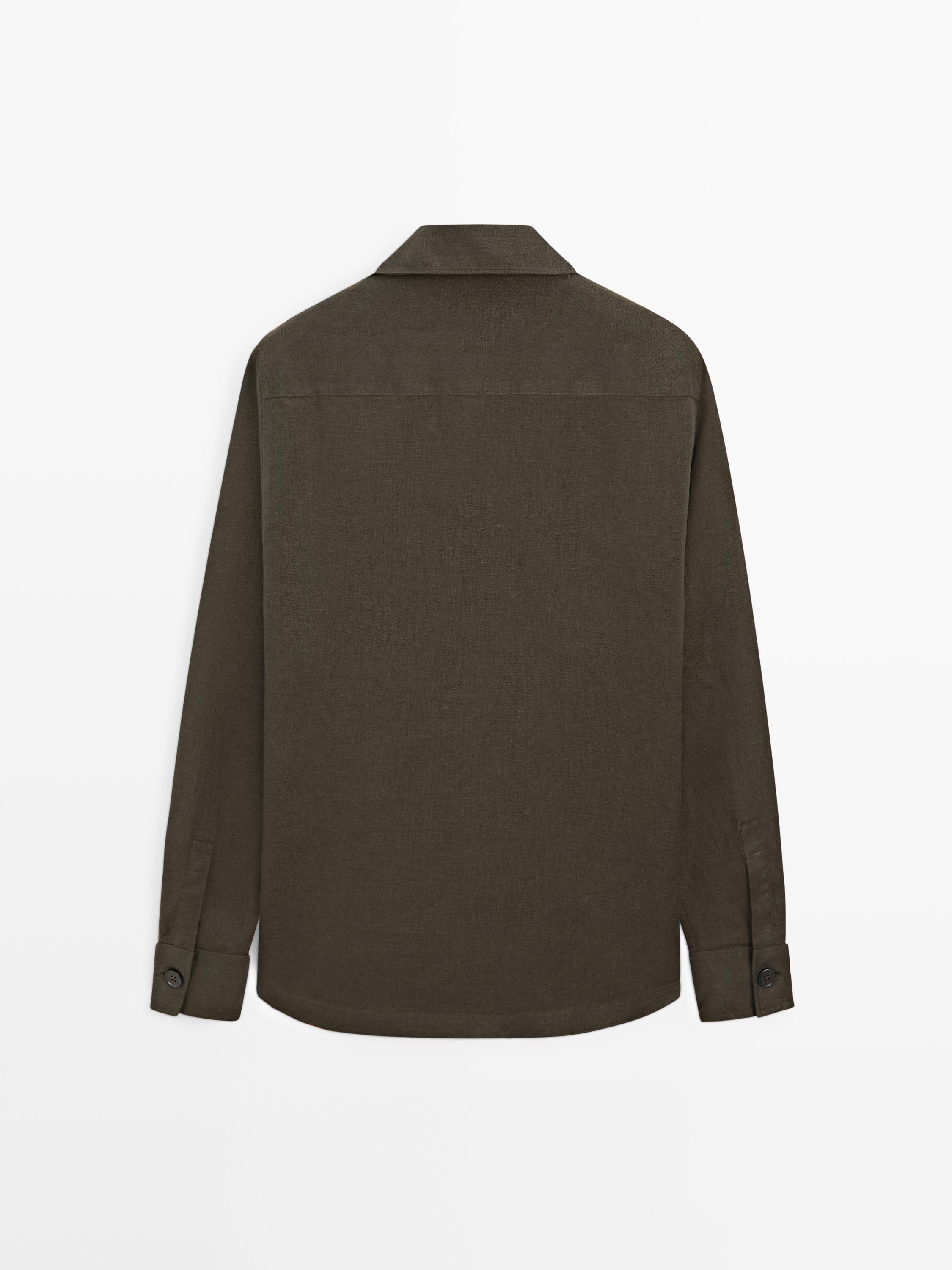 Rear view of a dark green long-sleeved casual shirt with buttoned cuffs.