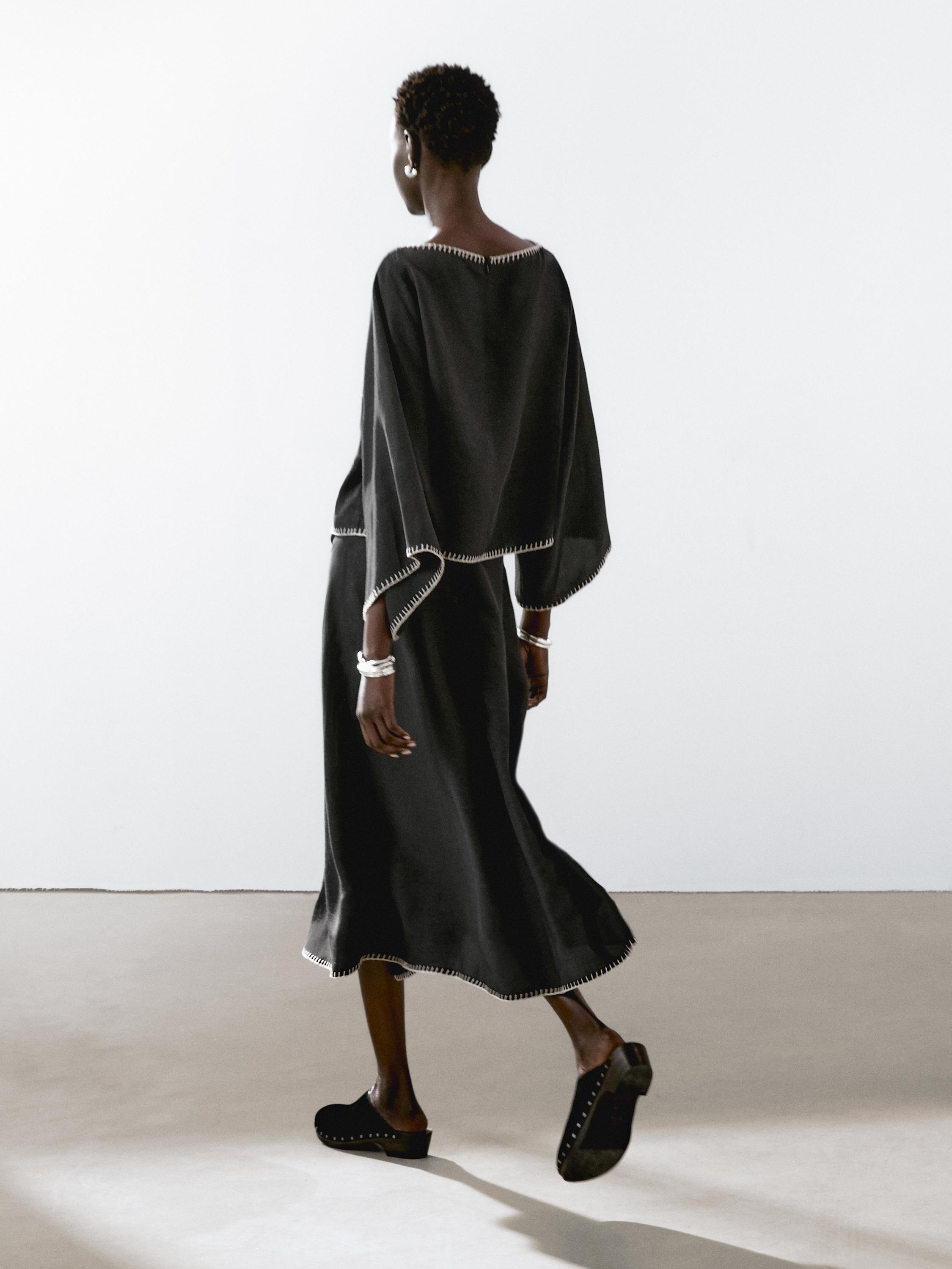 Cape blouse with batwing sleeves
