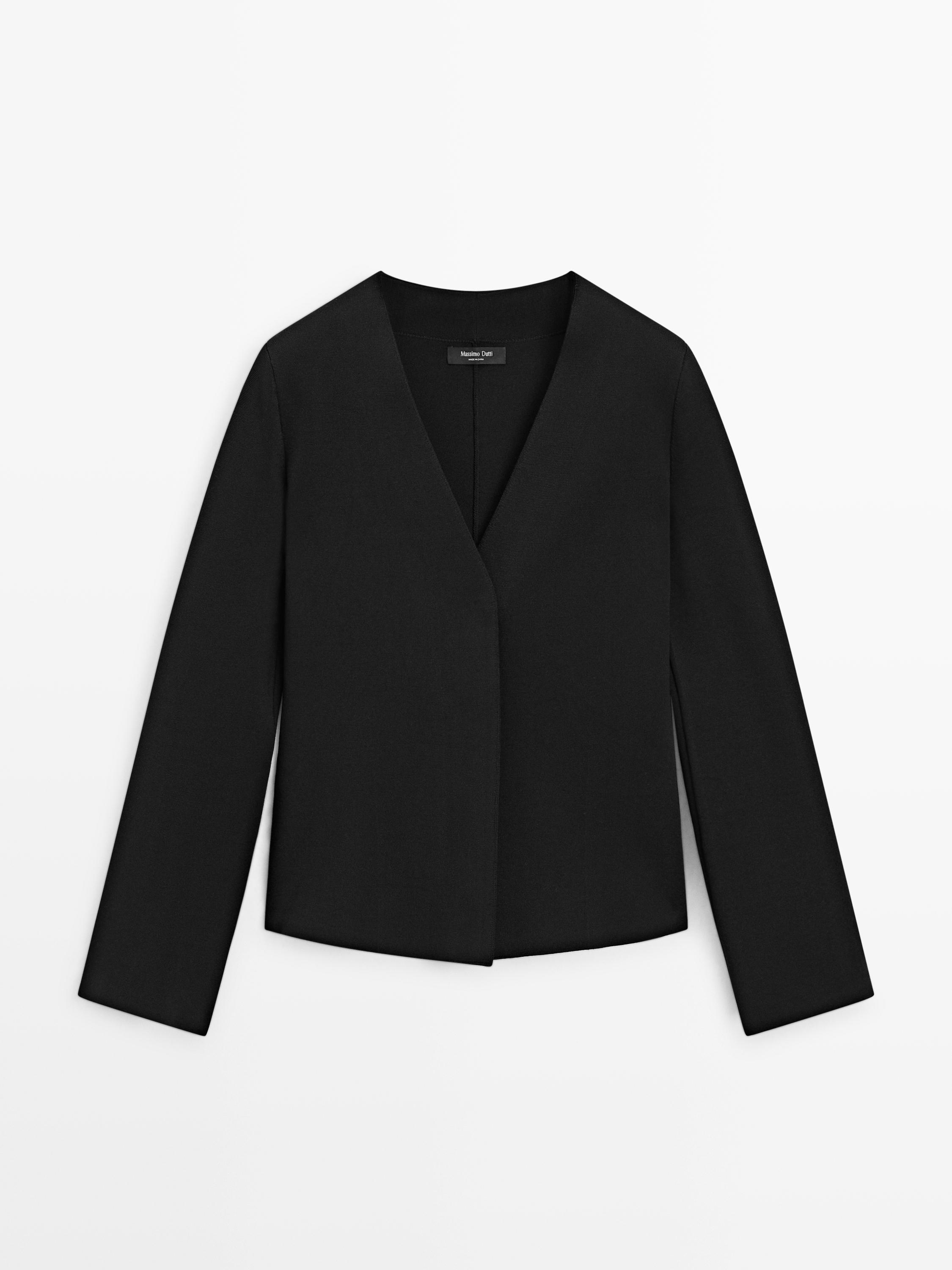 Front view of black cardigan with V-neckline and hidden closure.