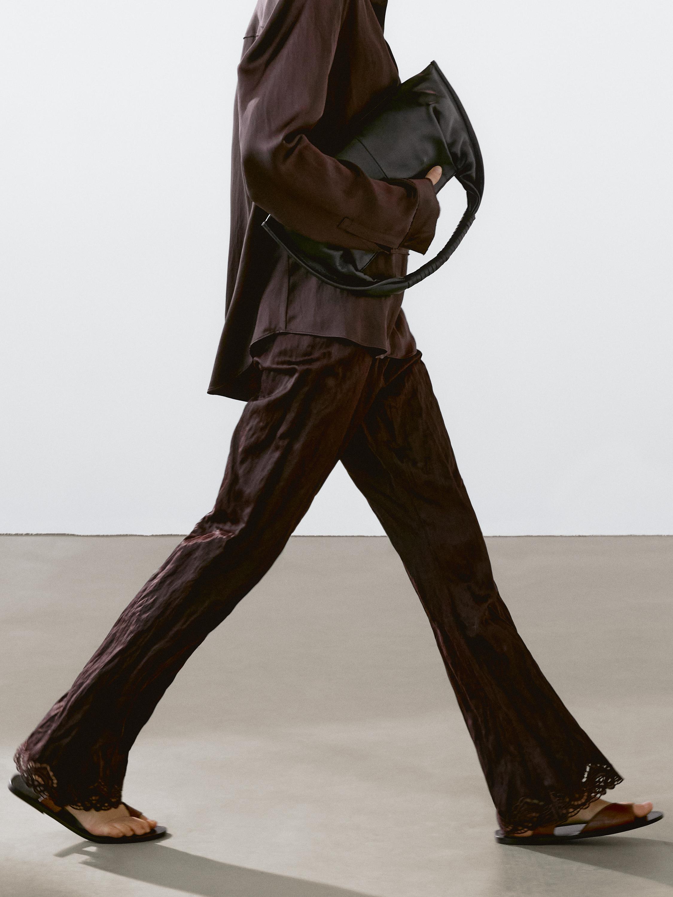 Capri trousers with blonde lace detail