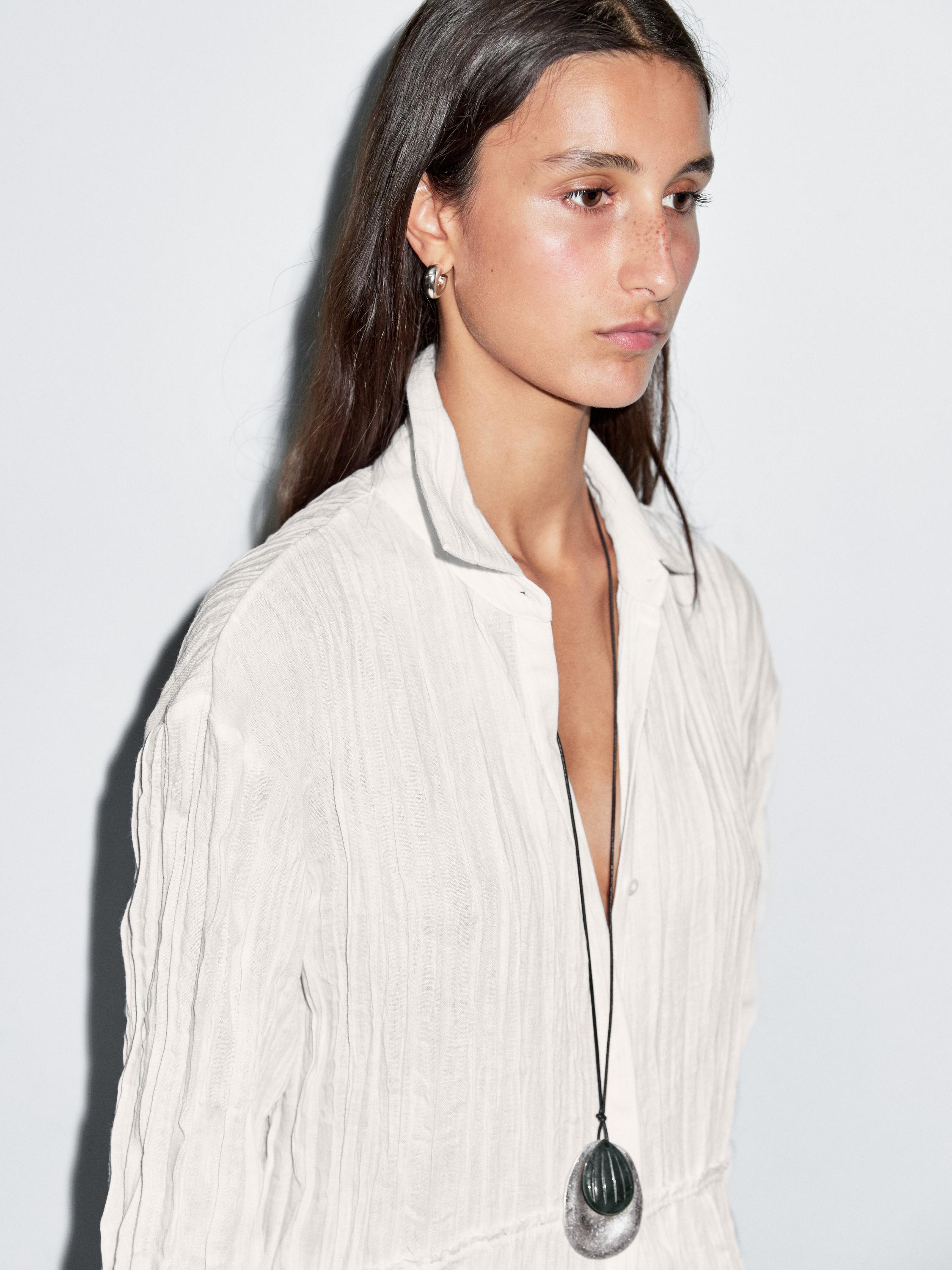 بلوزة بليسيه طويلة فضفاضة